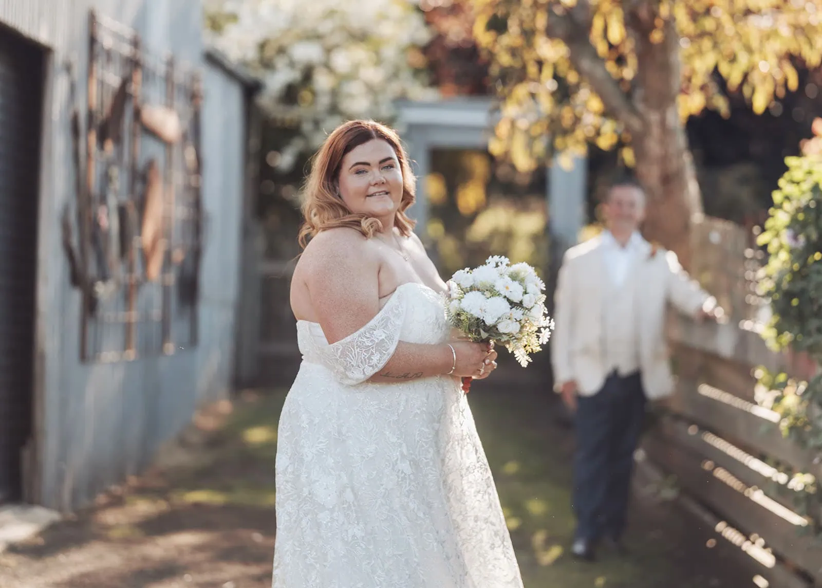 country victoria wedding in corrunnun – rachelle & anthony 354 Bride in lace gown at scenic outdoor wedding ceremony.