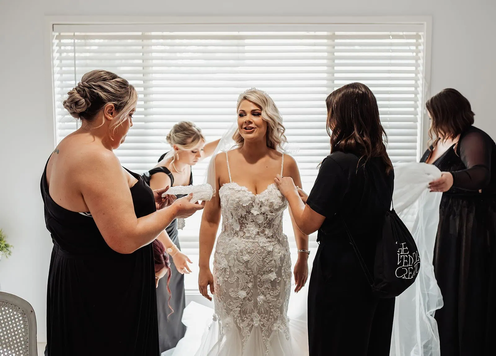 silvestris of clarendon wedding - sam & wayne 199 Bride getting ready on wedding day with makeup and gown.