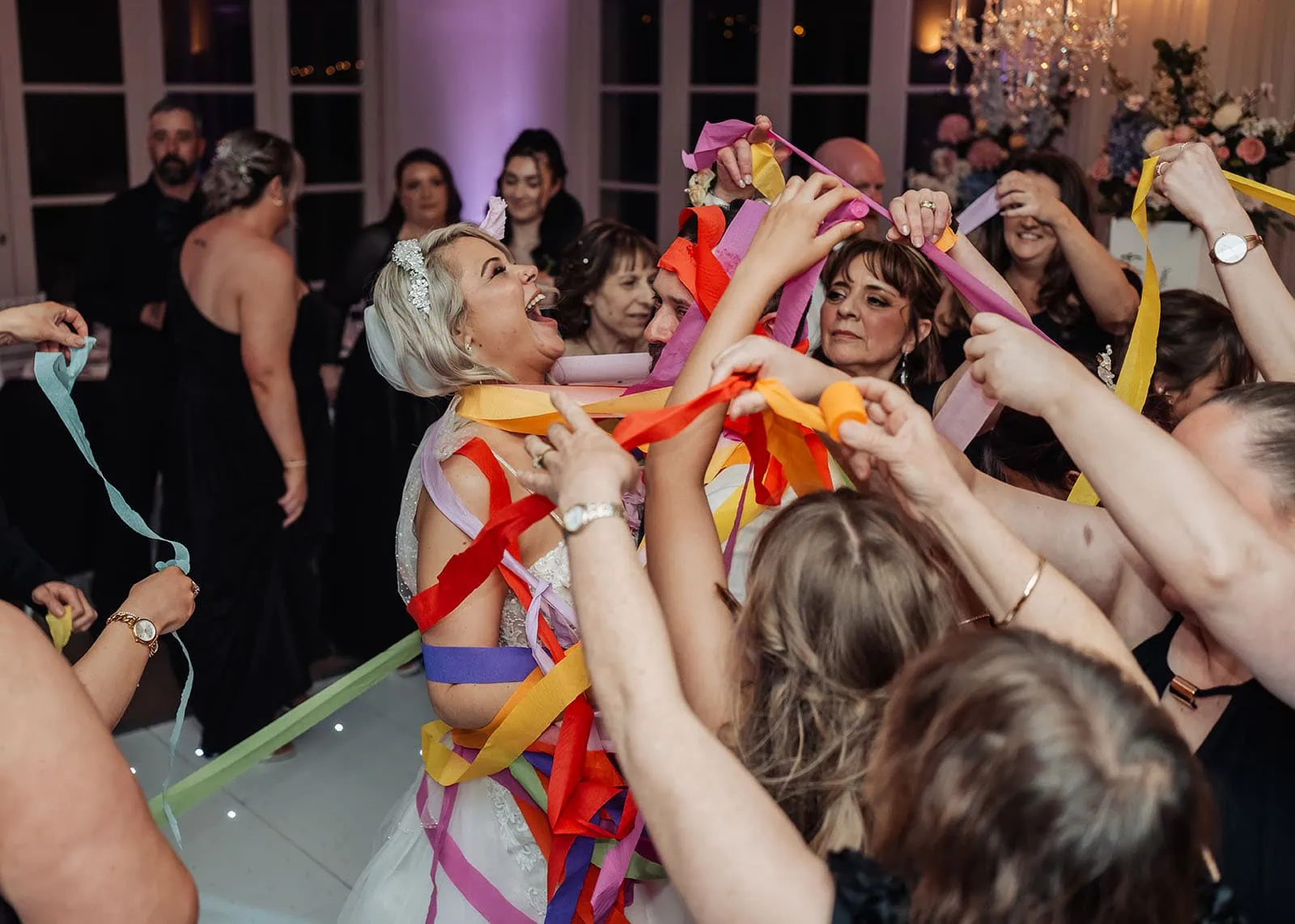 silvestris of clarendon wedding - sam & wayne 271 Bride Celebrating with Streamers at Wedding Party.