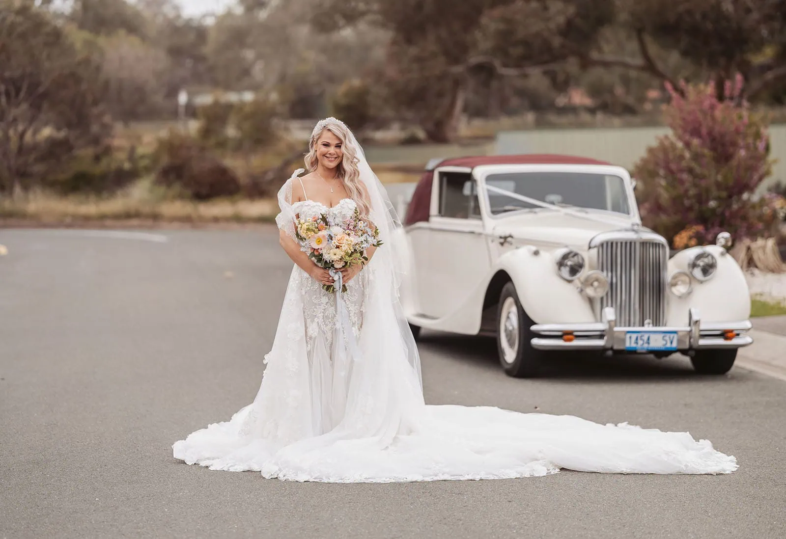 silvestris of clarendon wedding - sam & wayne 207 Bride in vintage car, classic wedding scene, romantic and elegant.