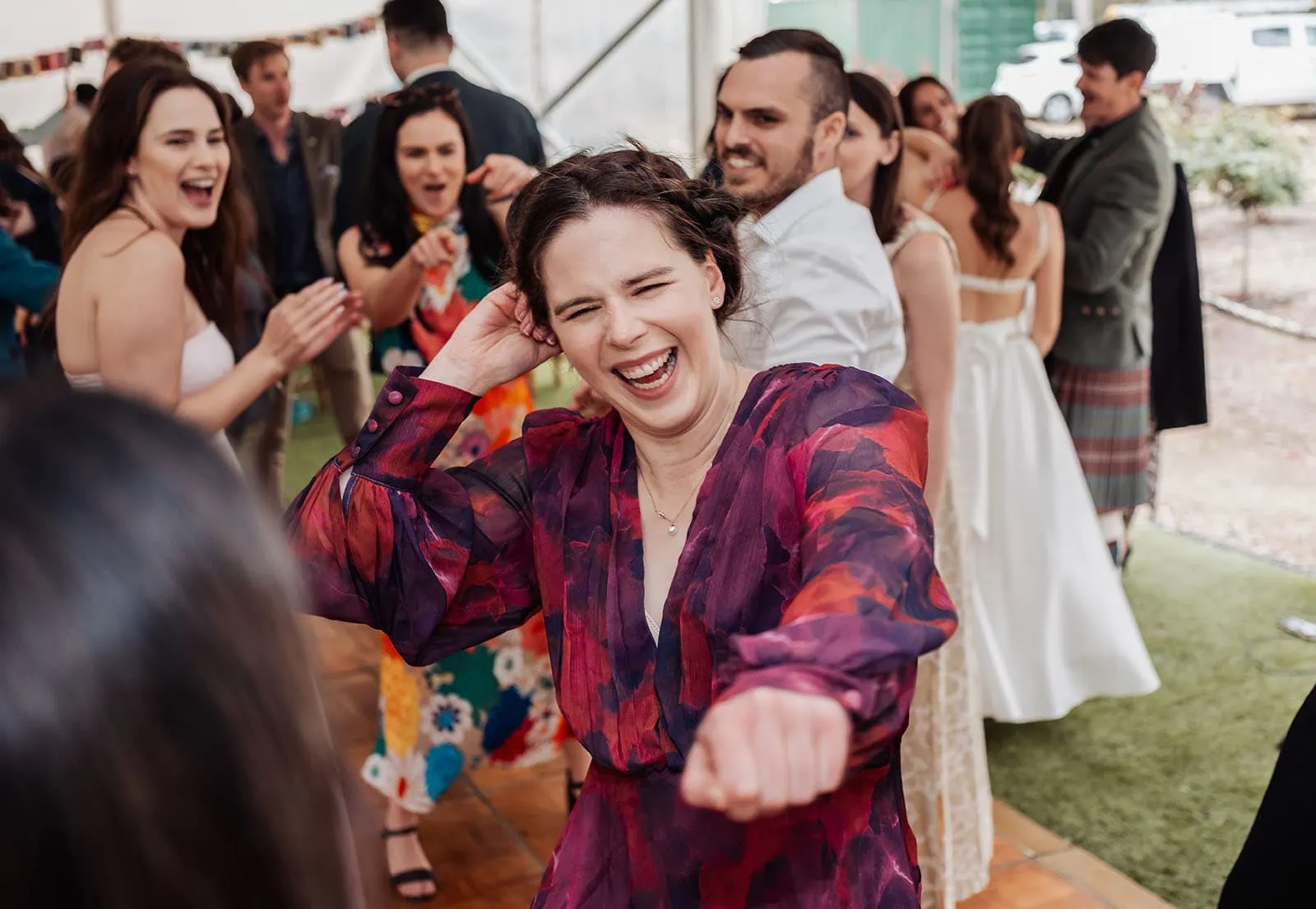 fleurieu cherries wedding - kimberley & richard 64 People celebrating with joyful dancing at a festive event.