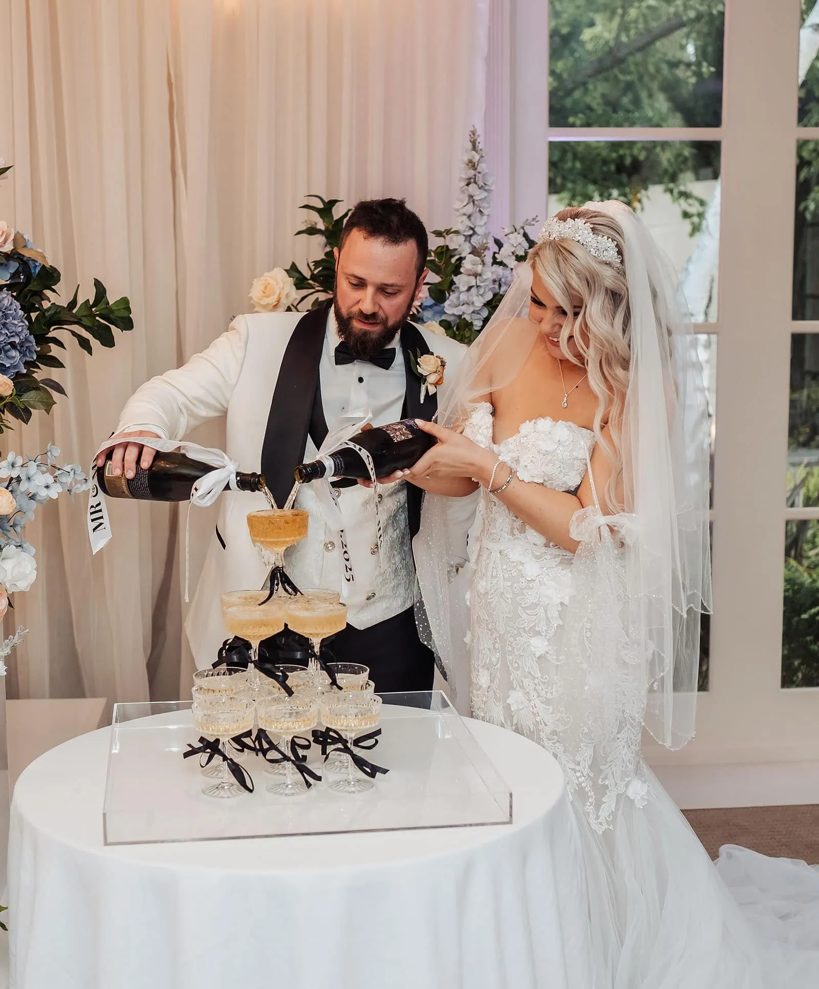 silvestris of clarendon wedding - sam & wayne 258 Champagne tower for wedding toast celebration with elegant glass arrangement.