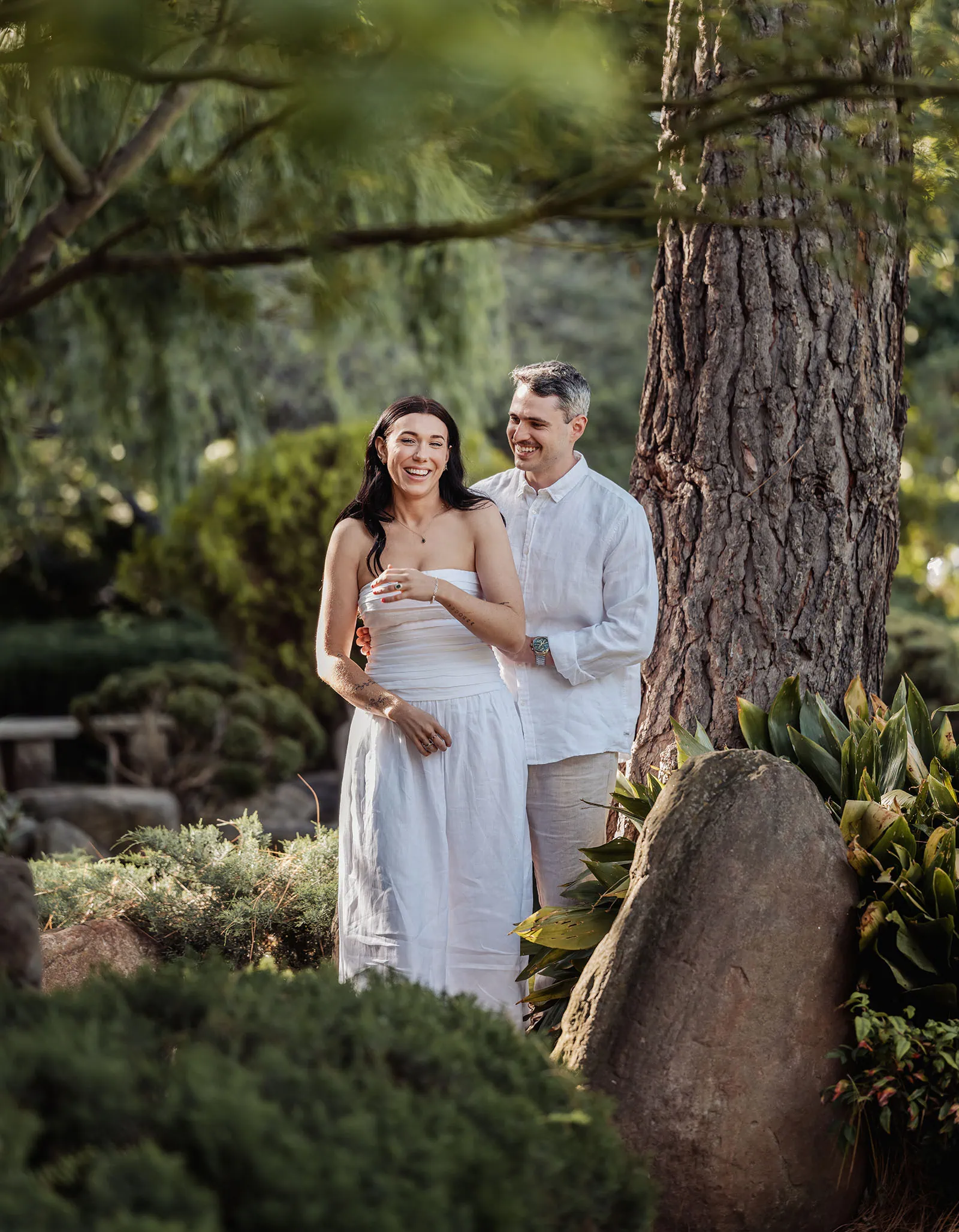 himeji gardens couples shoot - tom & tess 95 Happy couple enjoying a sunny summer day outdoors.