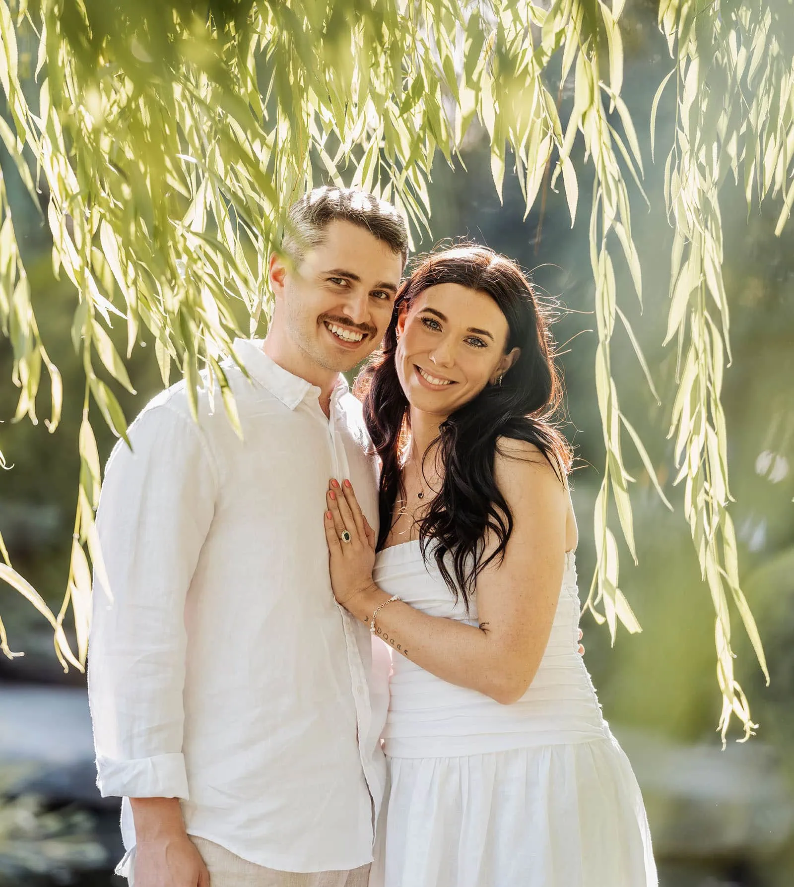 himeji gardens couples shoot - tom & tess 108 Romantic couple embracing outdoors during sunset with warm light.
