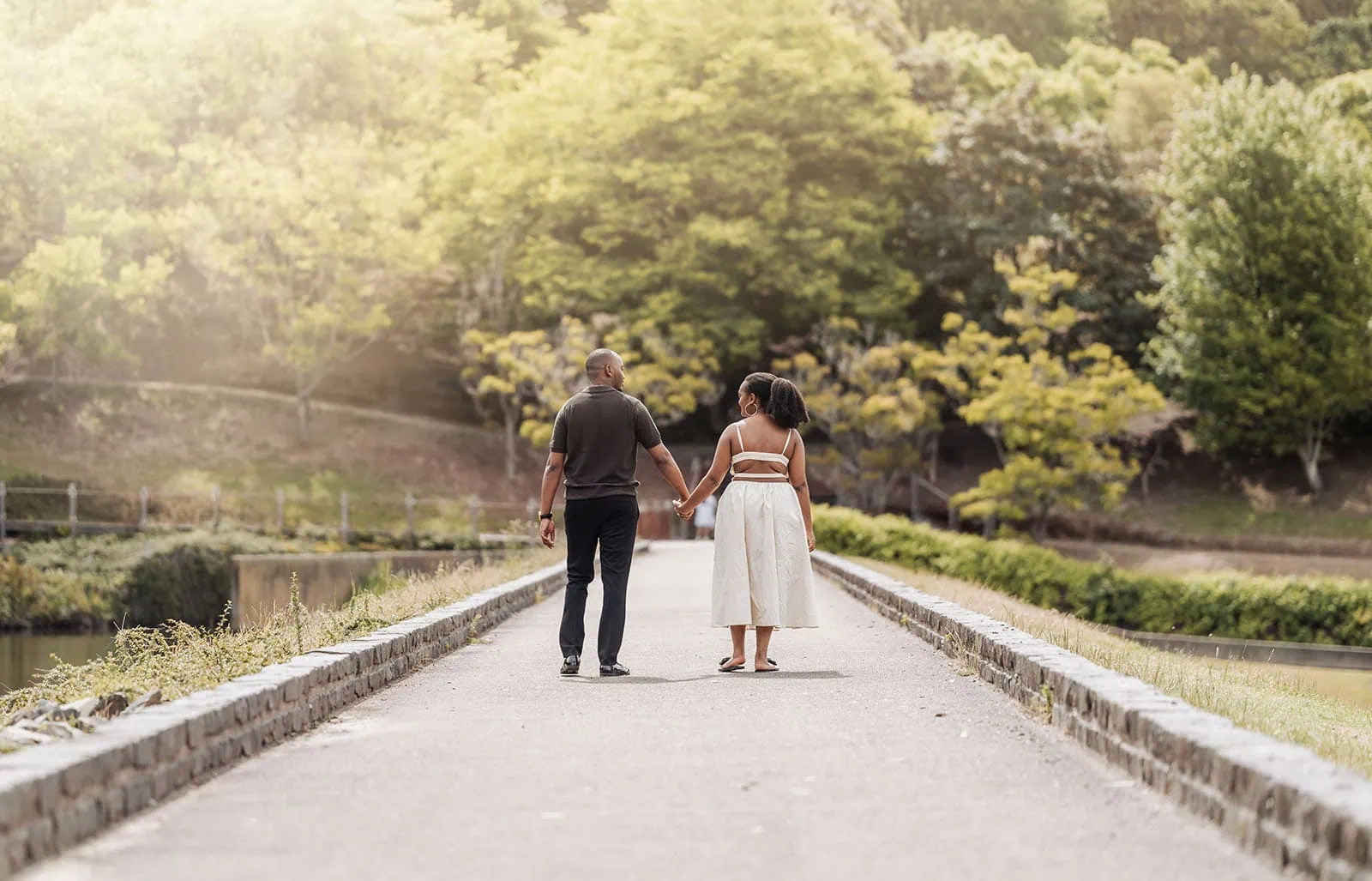 mt lofty botanic gardens couples shoot – ruth & emanuel 11 Couple enjoying a scenic park walk under sunny skies.