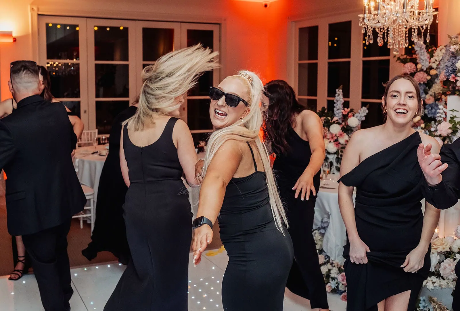 silvestris of clarendon wedding - sam & wayne 274 Dance floor celebration with vibrant lights and energetic partygoers.