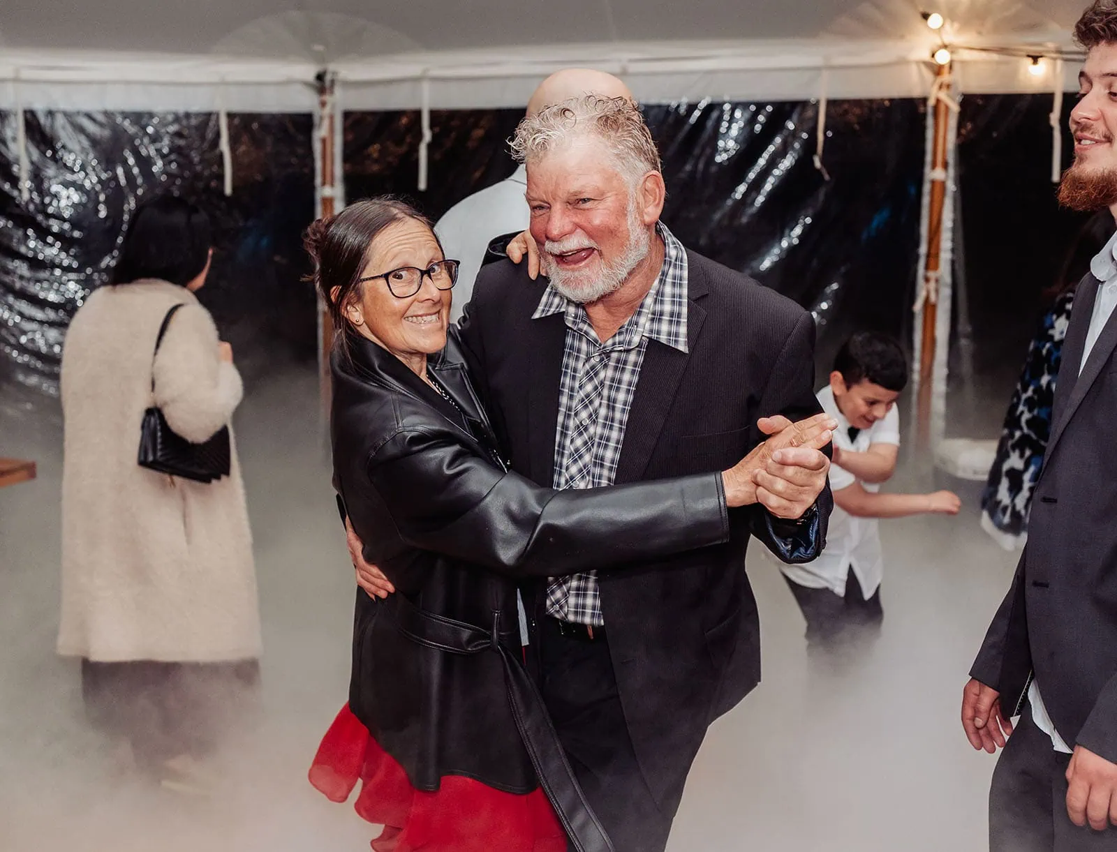 country victoria wedding in corrunnun – rachelle & anthony 378 Dancing couple celebrating joyfully on the dance floor with vibrant energy and happiness.