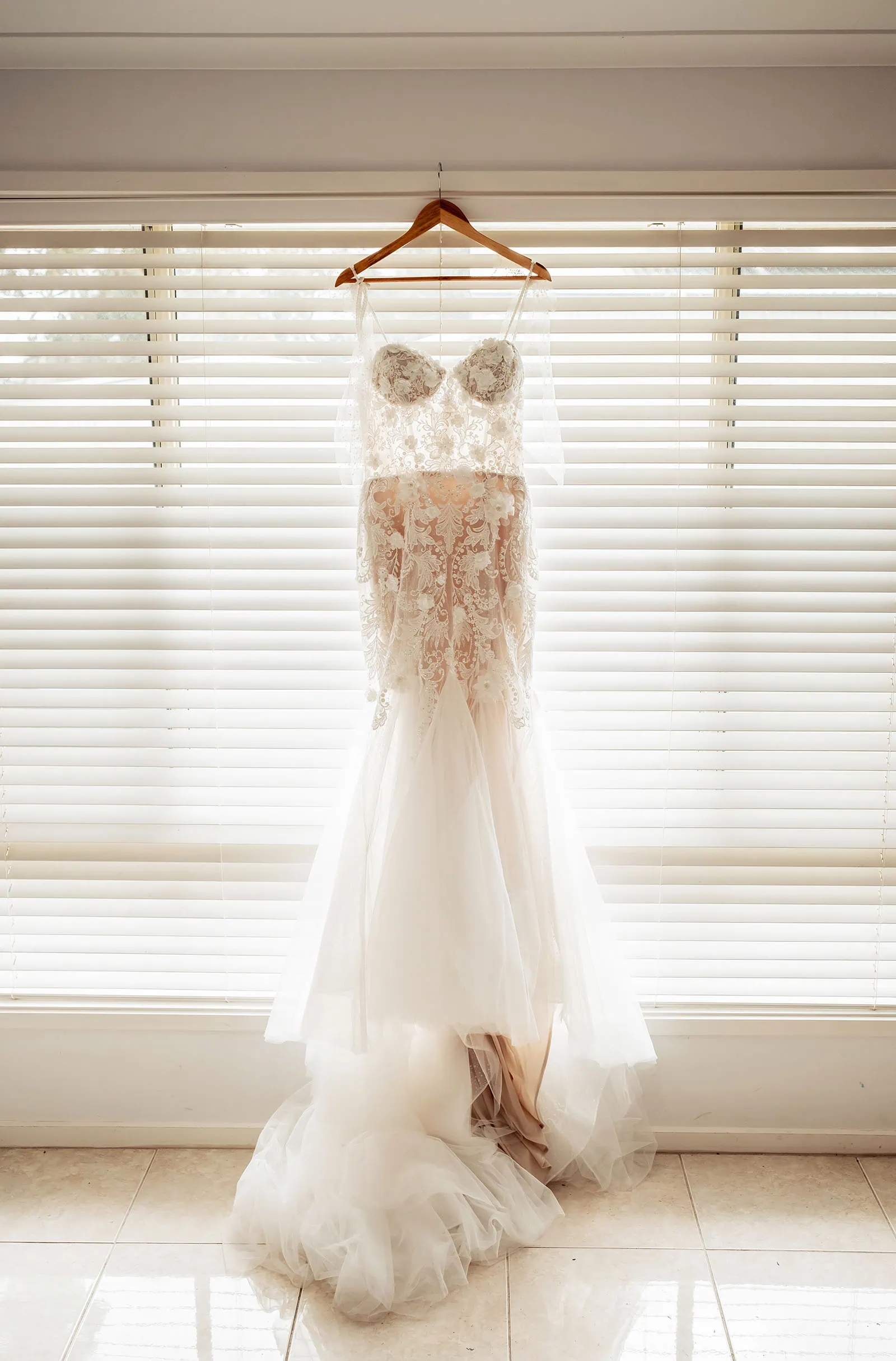 silvestris of clarendon wedding - sam & wayne 198 Elegant bridal gown with lace detailing and flowing train, perfect for weddings.