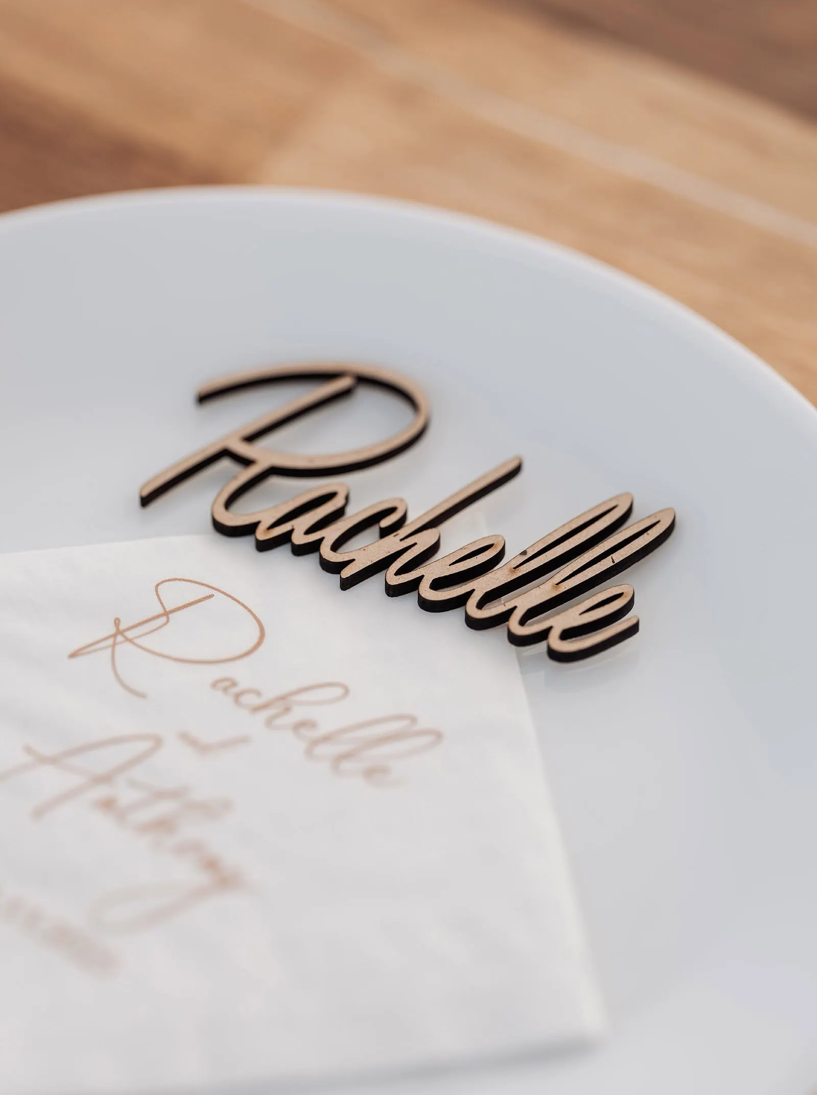 country victoria wedding in corrunnun – rachelle & anthony 360 Elegant name placard with gold accents on a wooden table setting.