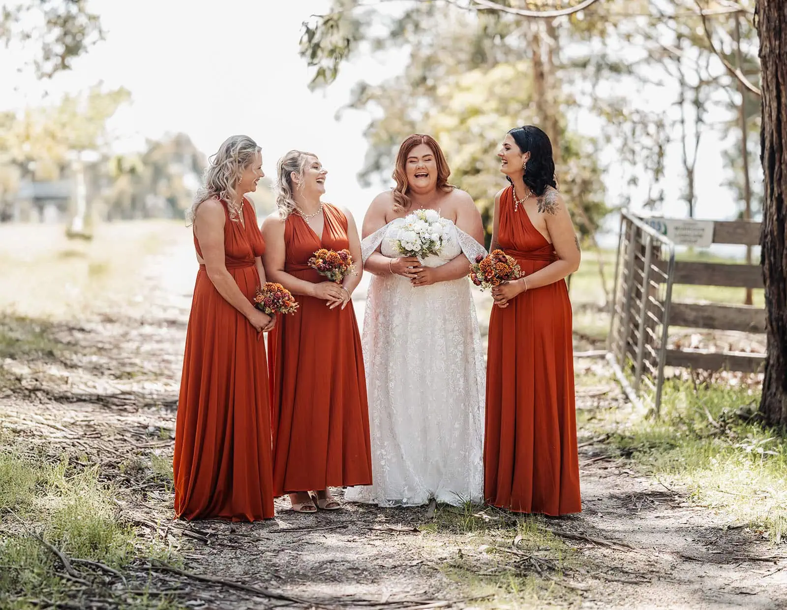 country victoria wedding in corrunnun – rachelle & anthony 309 Bride and bridesmaids at fall outdoor wedding in autumn colors.