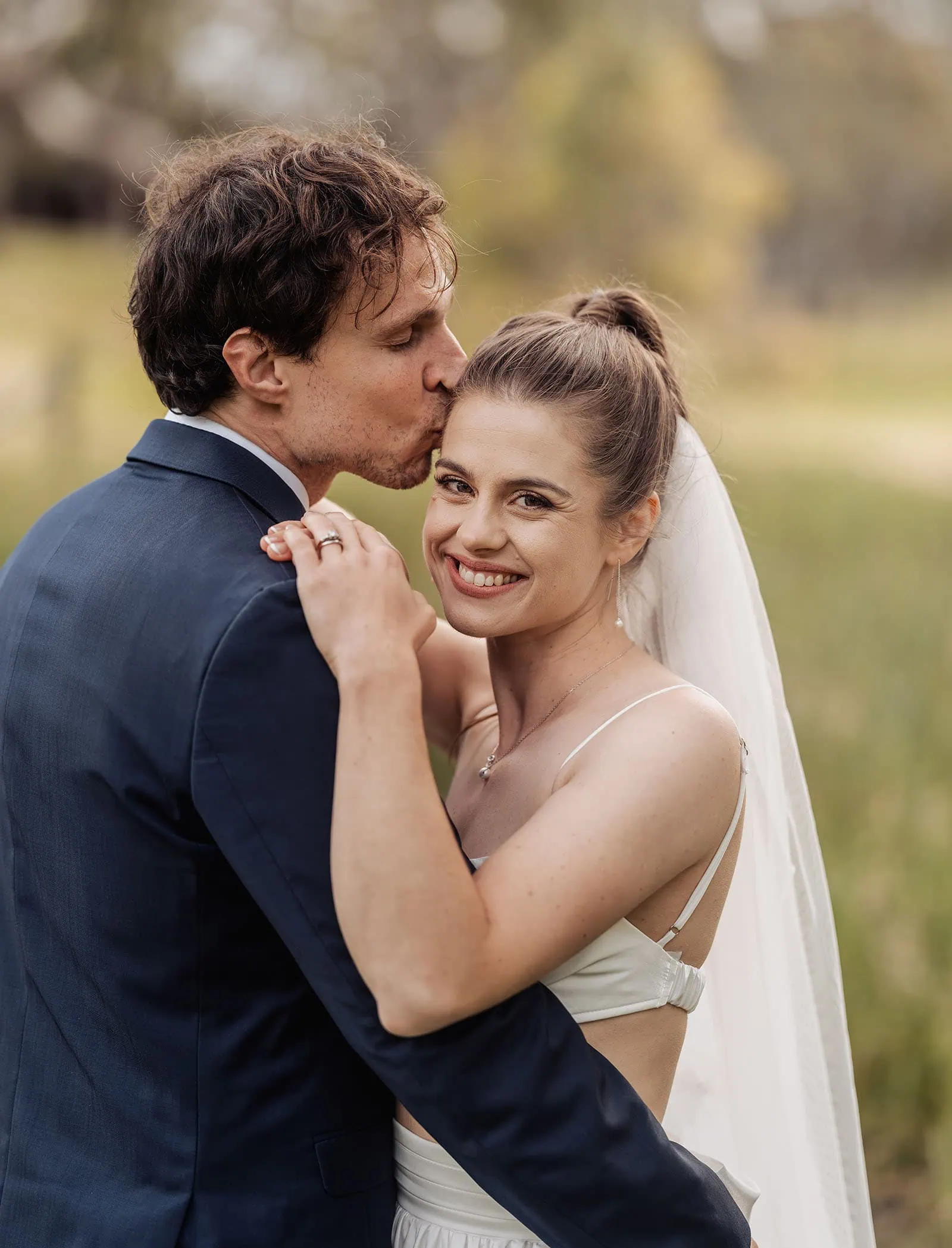 fleurieu cherries wedding - kimberley & richard 76 Bride and groom share tender forehead kiss in romantic wedding portrait.