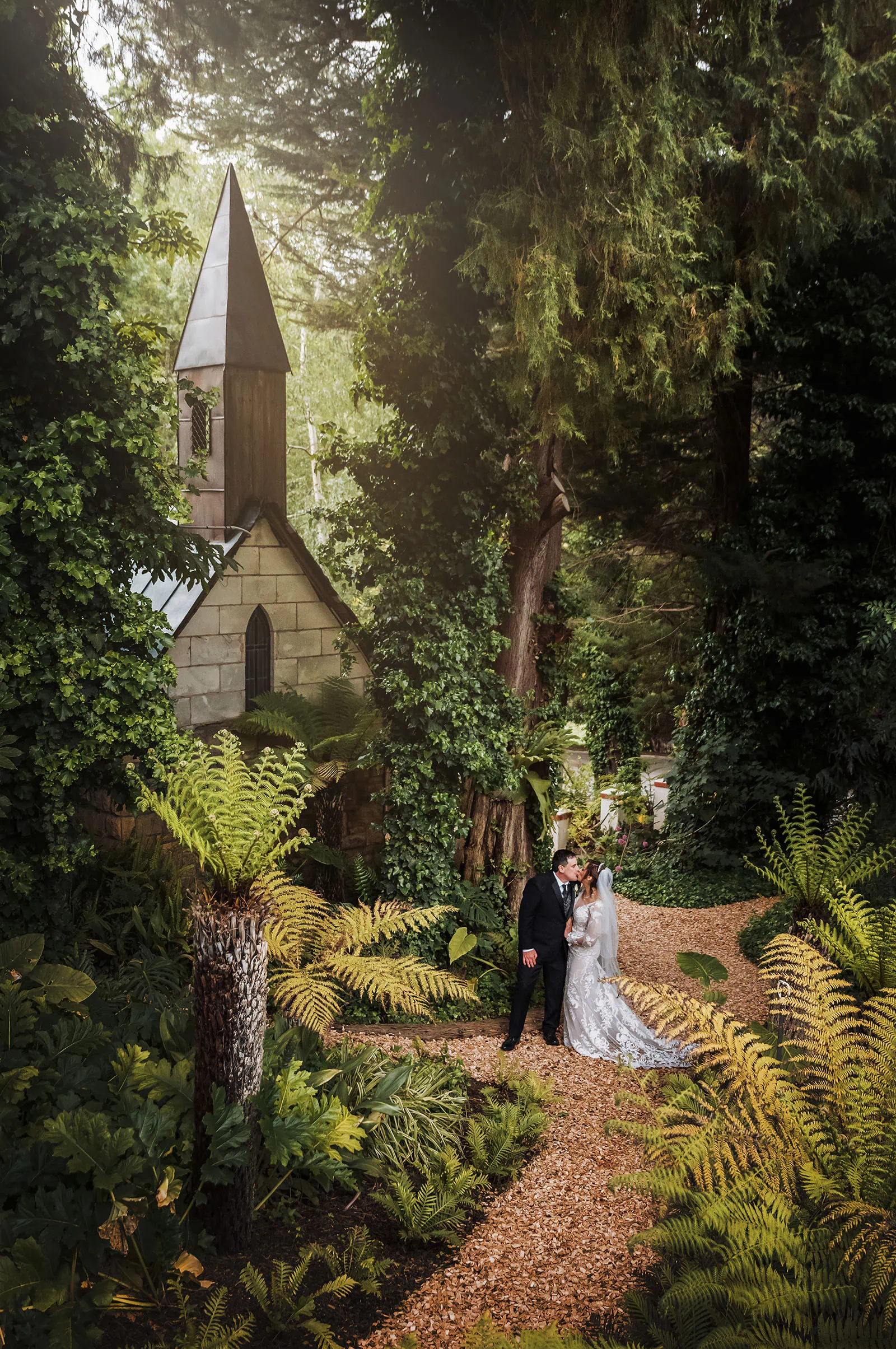 wedding at the manor in basket range - maryam & jason 147 Forest wedding ceremony with elegant outdoor decorations and joyful couple.