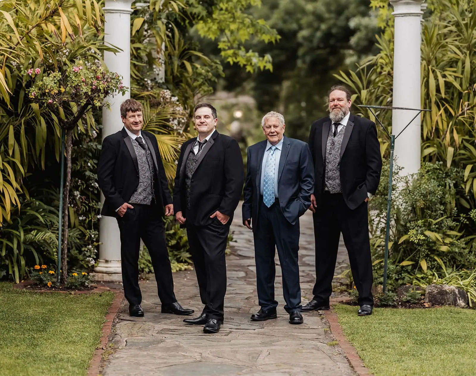 wedding at the manor in basket range - maryam & jason 117 Elegant garden party with lush greenery and stylish guests.