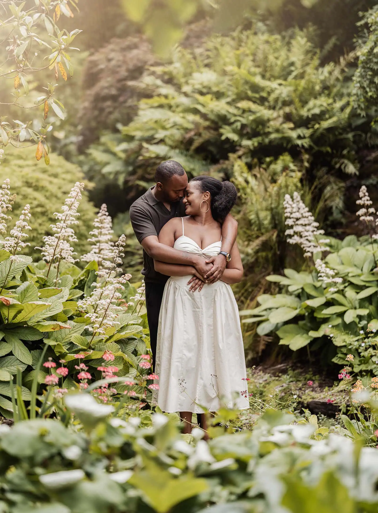 mt lofty botanic gardens couples shoot – ruth & emanuel 19 Couple embracing in a blooming garden, romantic scene, love, nature.