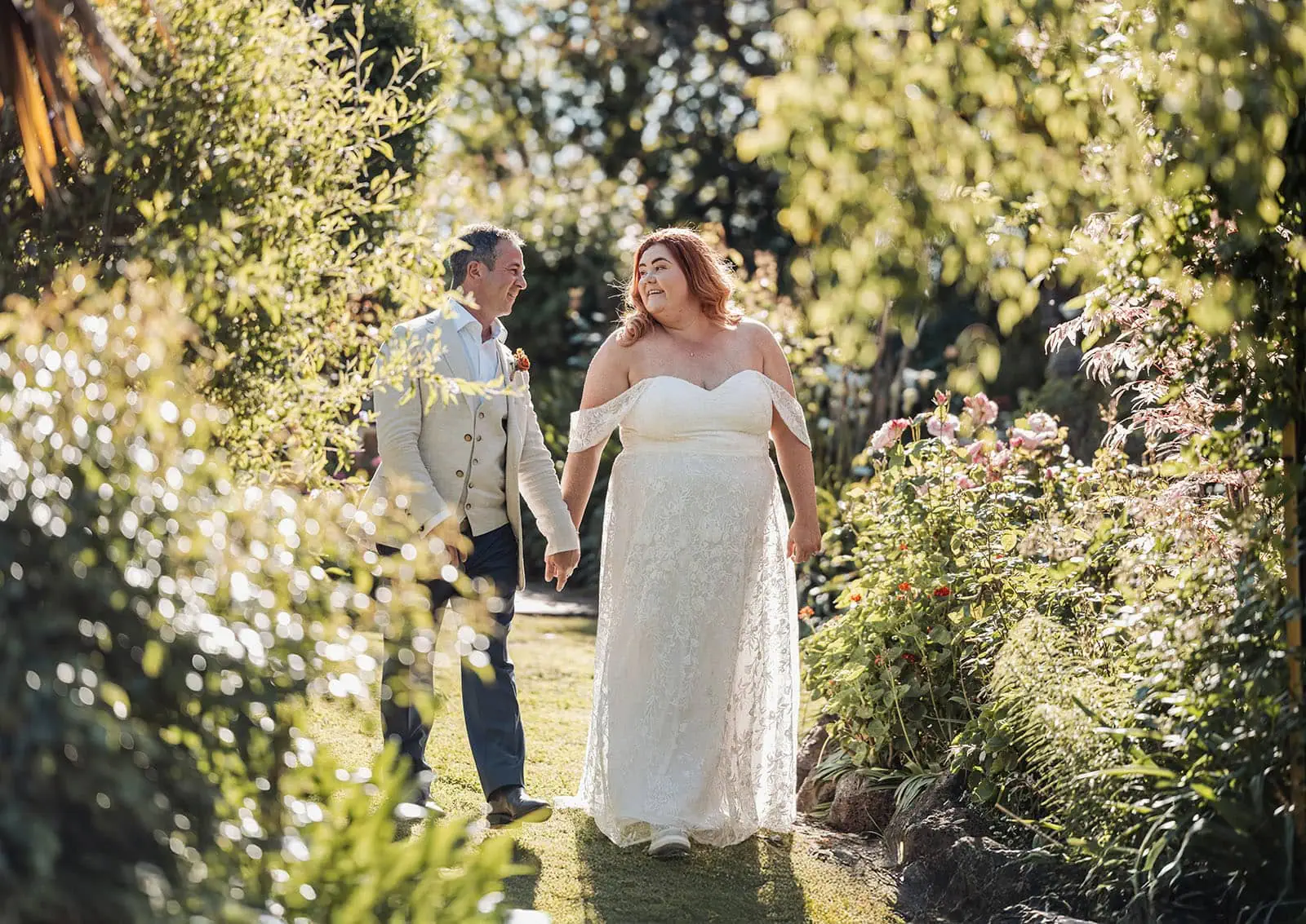 country victoria wedding in corrunnun – rachelle & anthony 338 Elegant couple in lush garden wedding setting, celebrating love and romance outdoors.