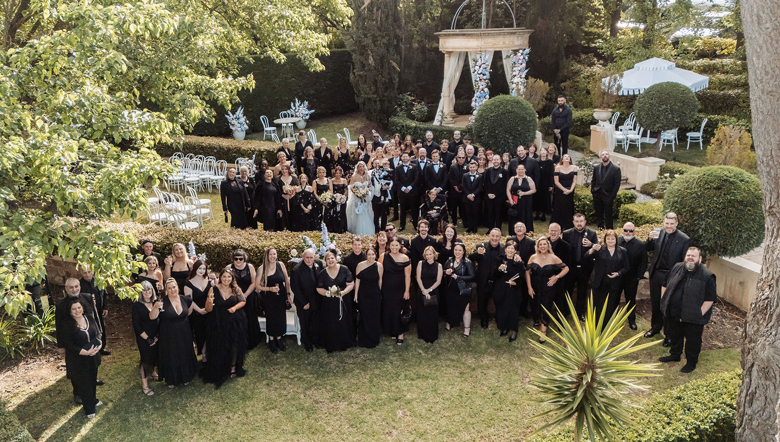 silvestris of clarendon wedding - sam & wayne 229 Elegant garden wedding with guests celebrating under the sunset.