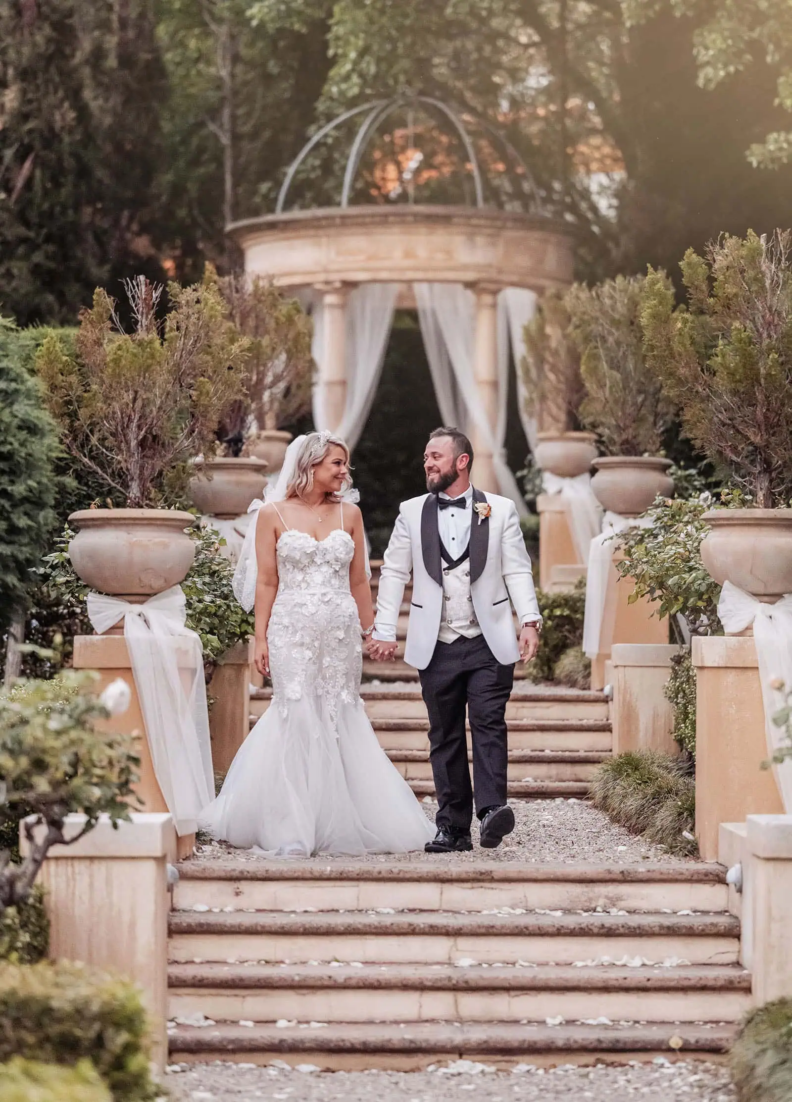 silvestris of clarendon wedding - sam & wayne 243 Romantic garden wedding scene with flowers and elegant decorations.