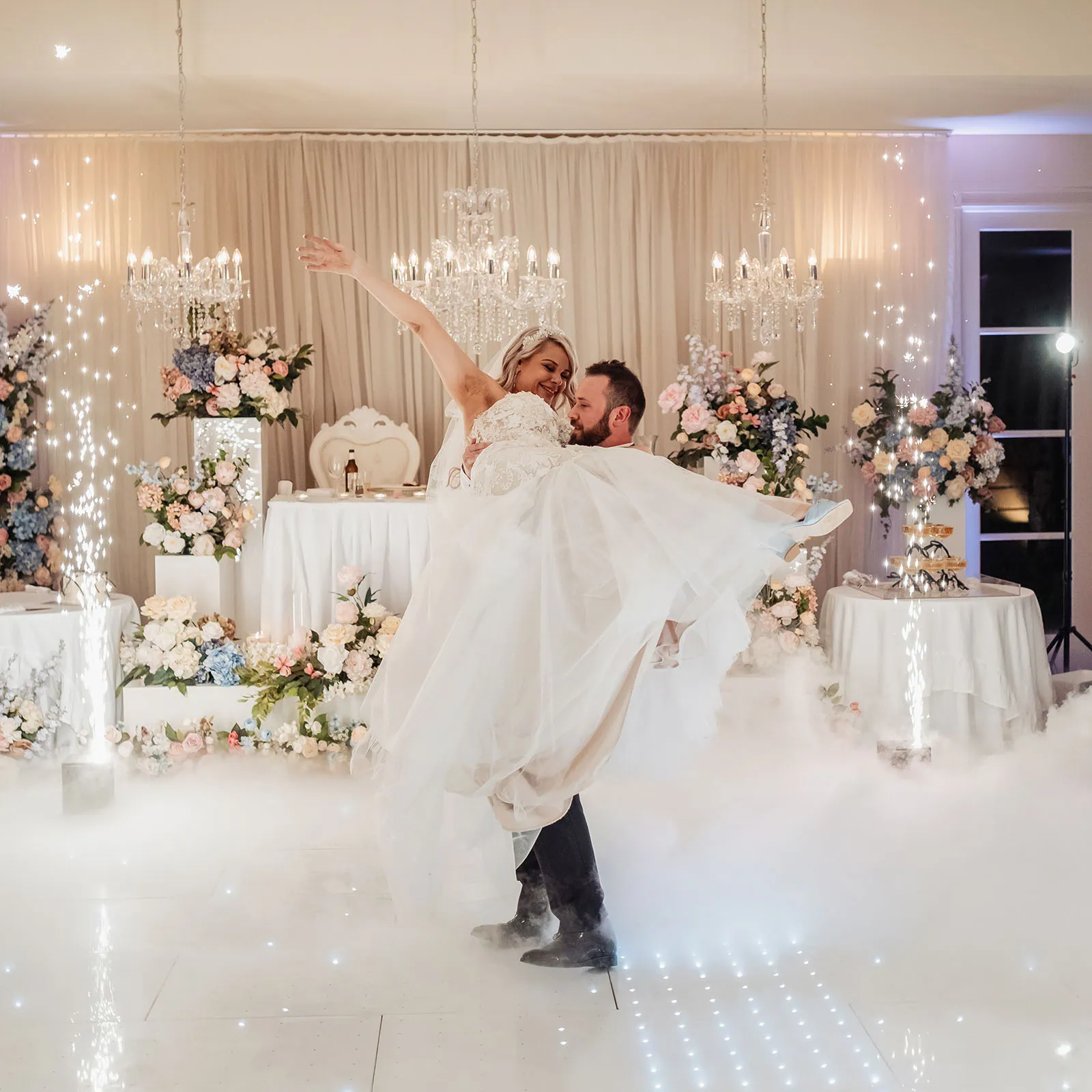 silvestris of clarendon wedding - sam & wayne 267 Groom lifting bride in joyful wedding celebration scene.