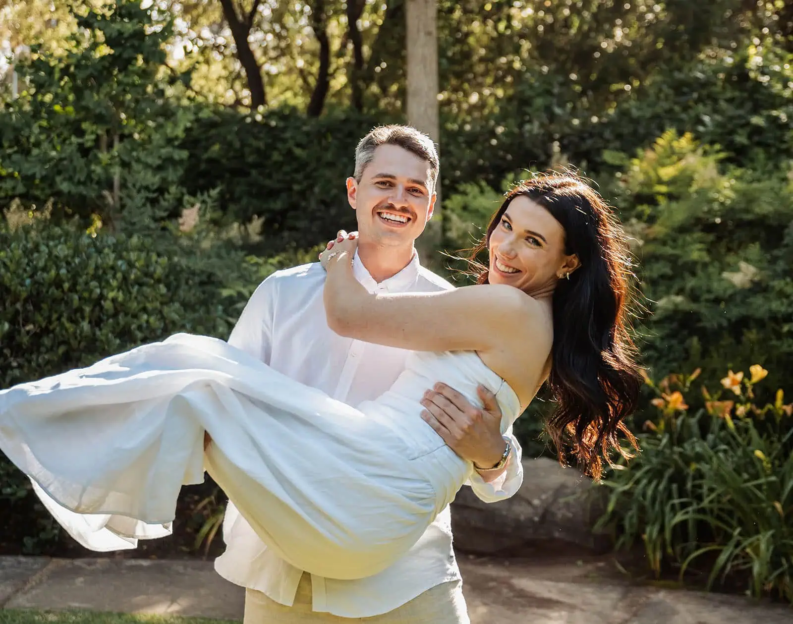 himeji gardens couples shoot - tom & tess 105 Smiling couple enjoying time together in a lush garden.