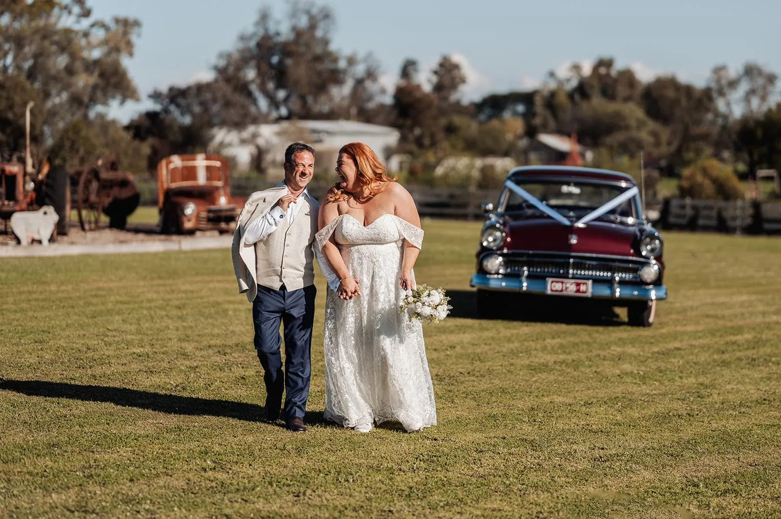 country victoria wedding in corrunnun – rachelle & anthony 346 Joyful bride and groom celebrating love in a picturesque outdoor setting.