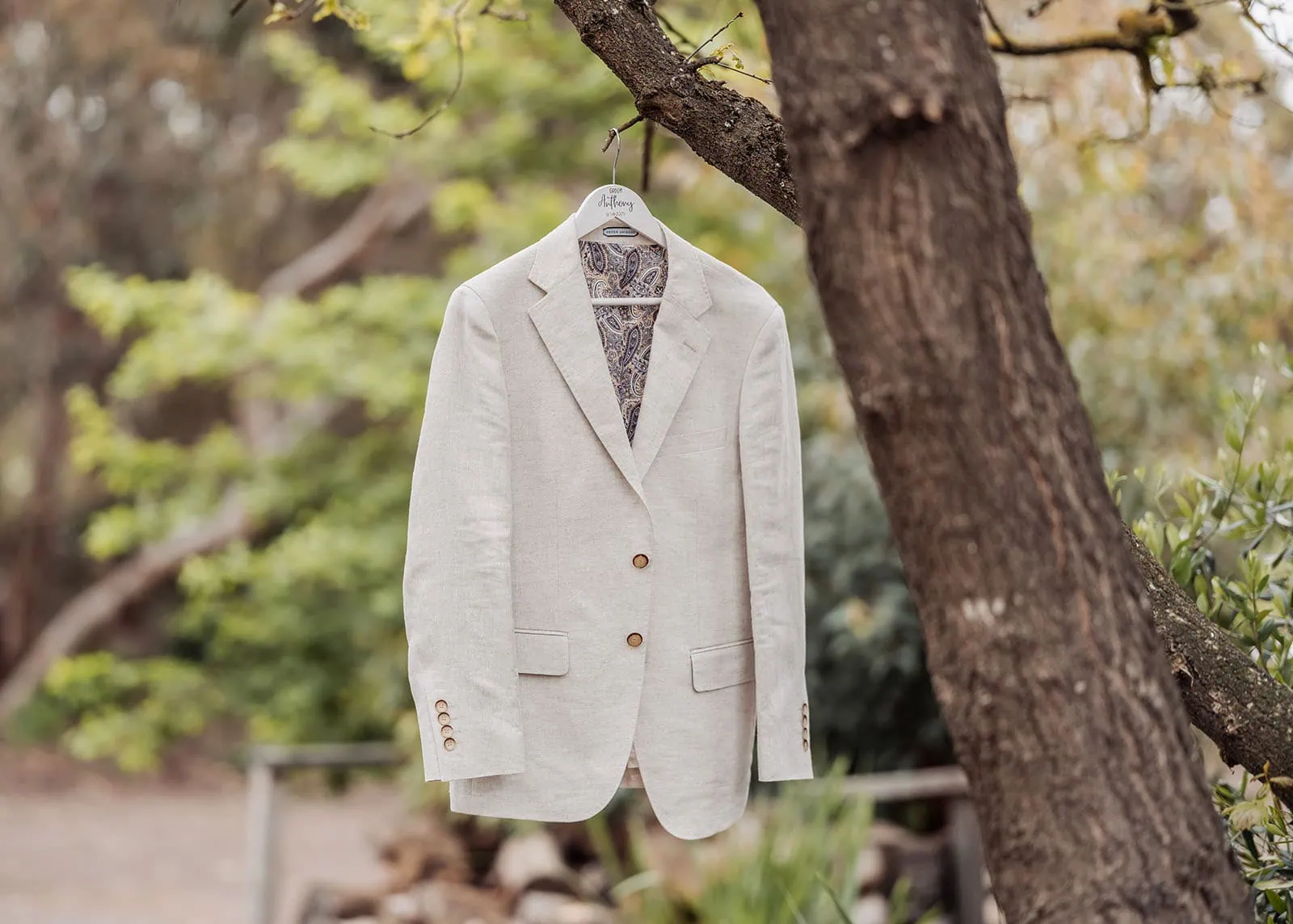 country victoria wedding in corrunnun – rachelle & anthony 279 Jacket hanging on a tree branch outdoors in nature.