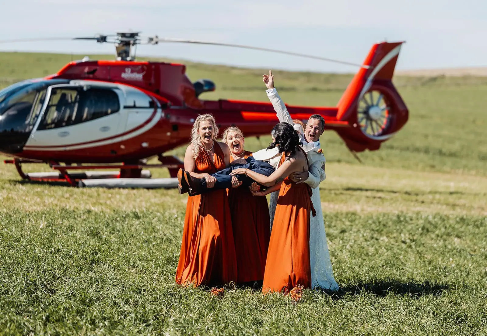country victoria wedding in corrunnun – rachelle & anthony 331 Happy group enjoying nature in a sunny field.