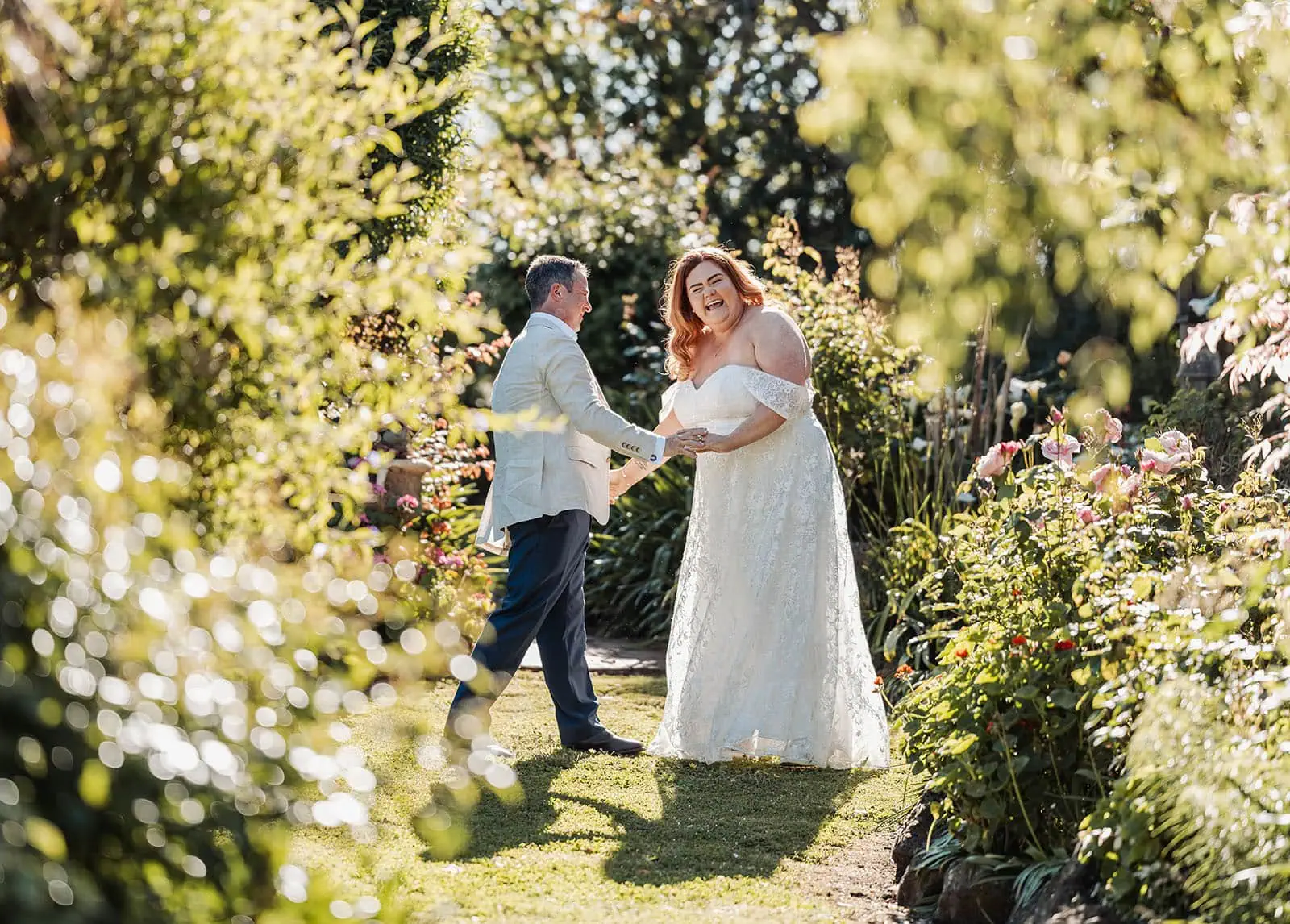 country victoria wedding in corrunnun – rachelle & anthony 336 Happy couple gardening together in a lush garden.