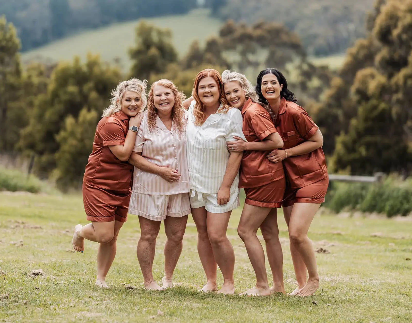 country victoria wedding in corrunnun – rachelle & anthony 304 A joyful outdoor gathering with smiling people enjoying sunny weather.