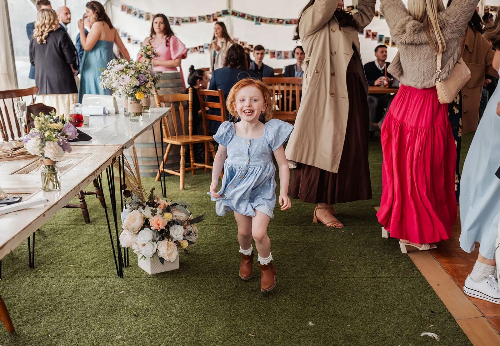 fleurieu cherries wedding - kimberley & richard 65 Girl joyfully celebrates with confetti in the air, radiating happiness and excitement.