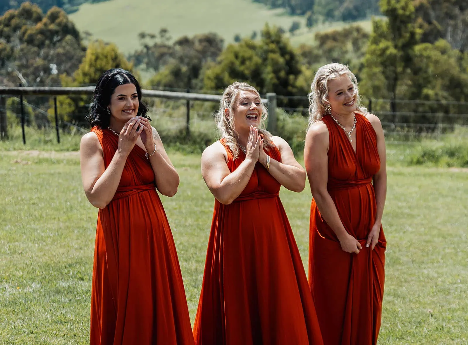 country victoria wedding in corrunnun – rachelle & anthony 307 Happy family playing outdoors in a sunny meadow.