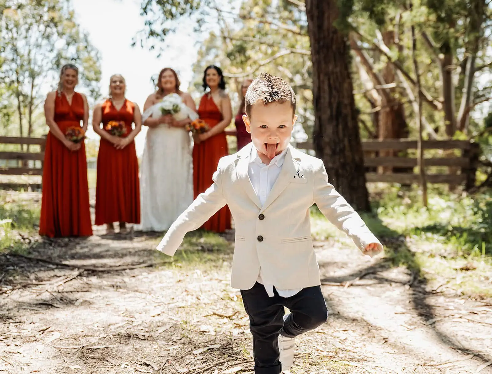 country victoria wedding in corrunnun – rachelle & anthony 310 Joyful couple celebrates a romantic outdoor wedding ceremony surrounded by nature.