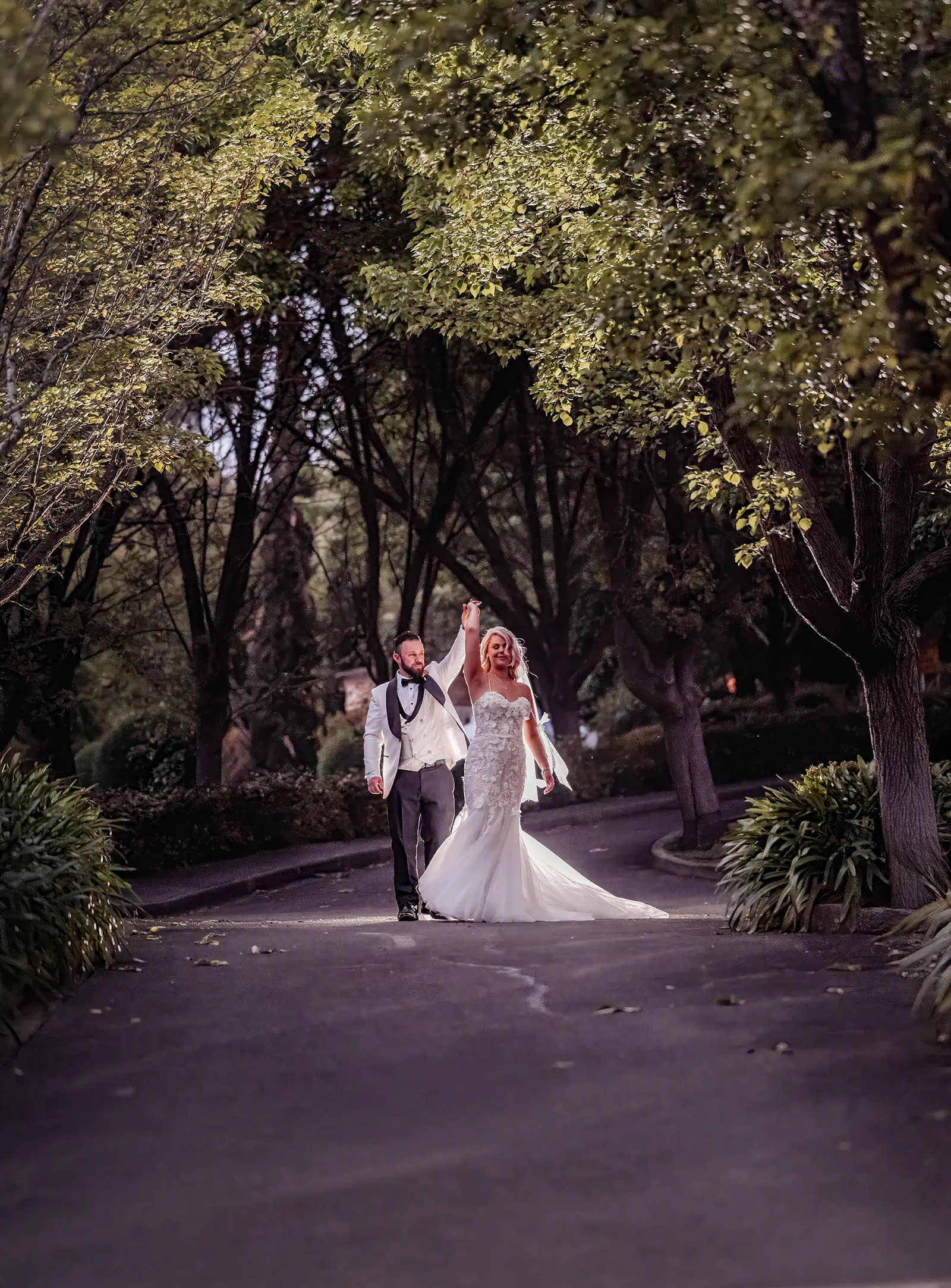 silvestris of clarendon wedding - sam & wayne 248 Happy bride and groom celebrating wedding day, outdoors, smiling joyfully.