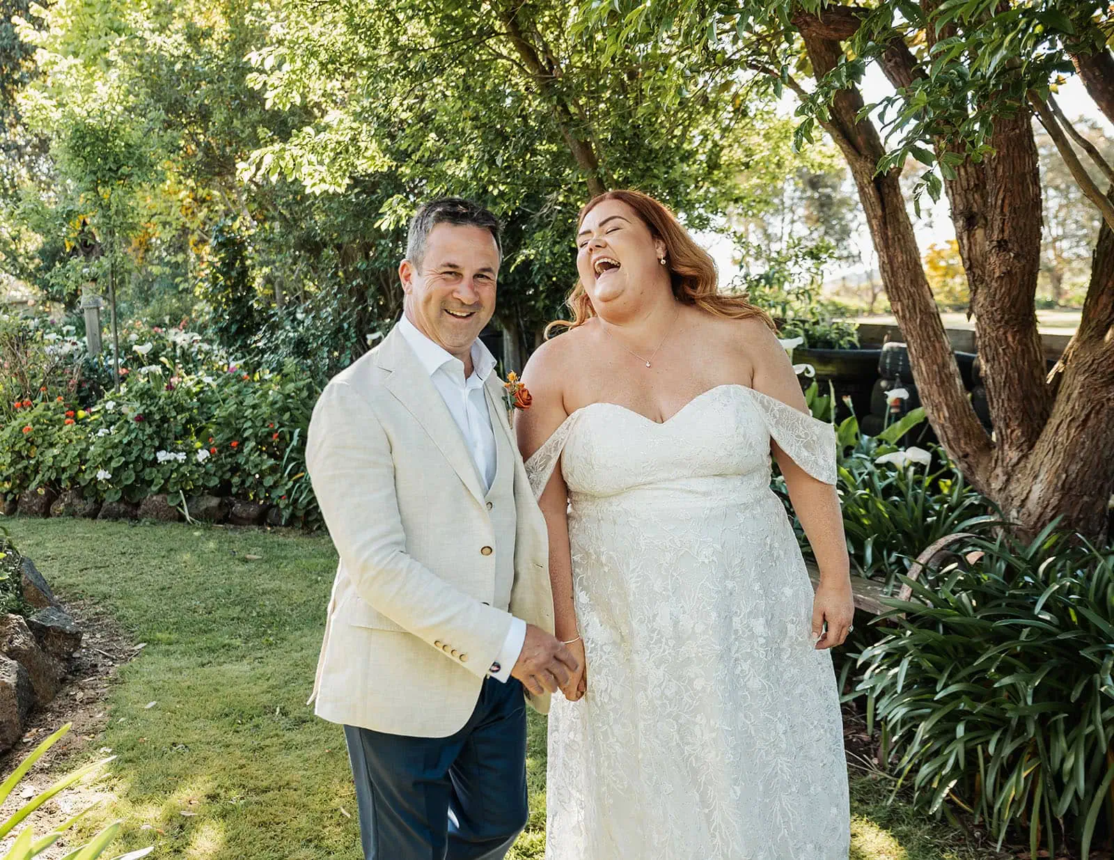 country victoria wedding in corrunnun – rachelle & anthony 342 Beautiful garden wedding scene with flowers, happy couple, and joyful celebration.