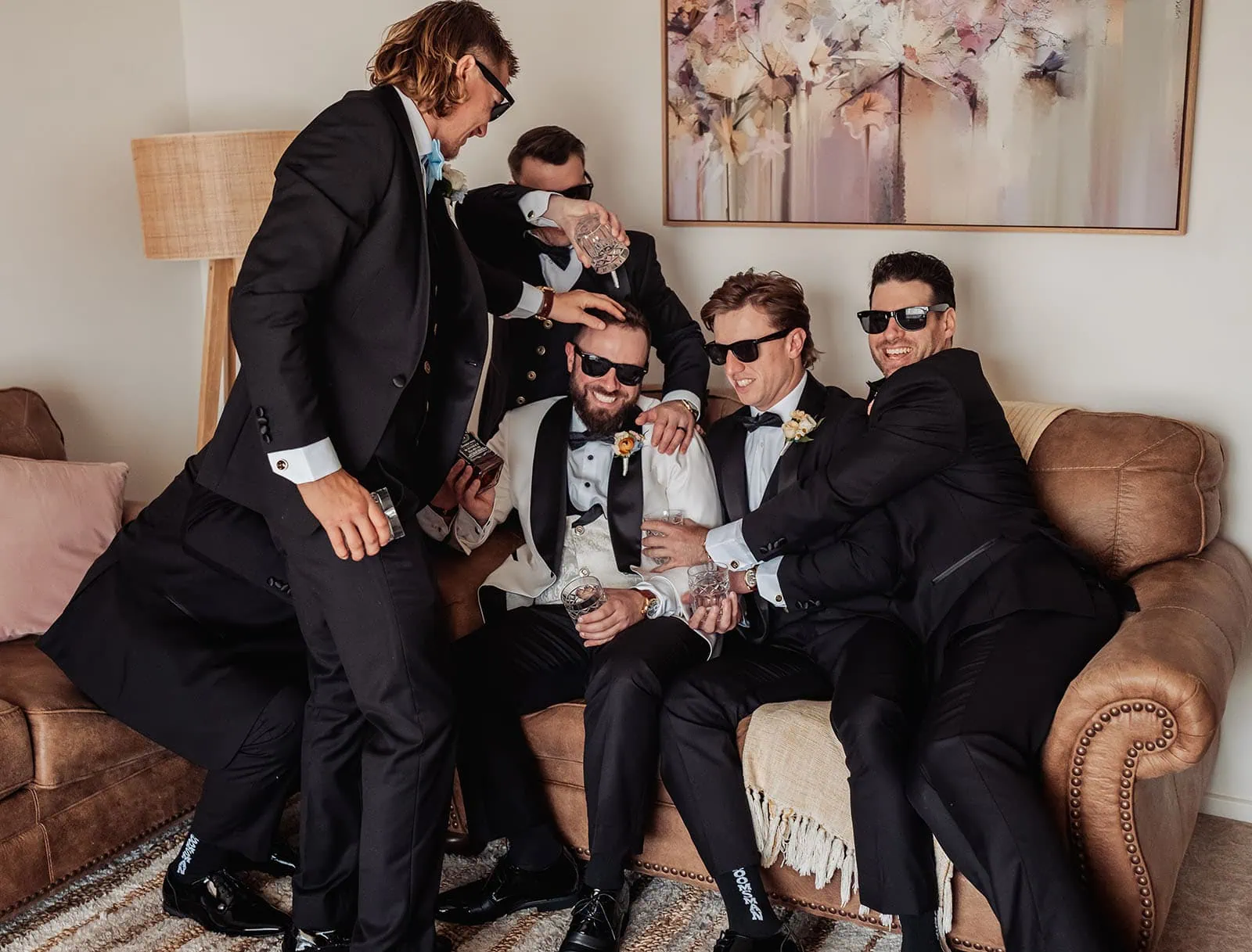 silvestris of clarendon wedding - sam & wayne 190 groom celebrate with joyous wedding party friends.