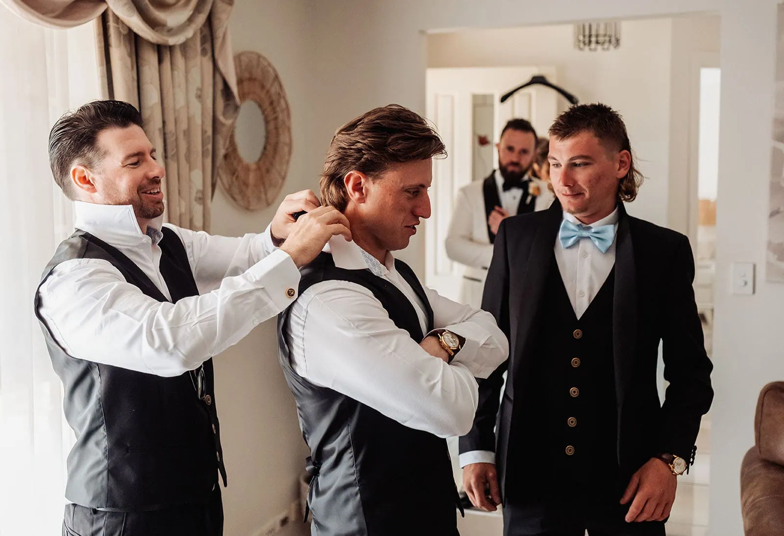 silvestris of clarendon wedding - sam & wayne 189 Group of friends laughing and bonding outdoors, sharing joyful moments together.