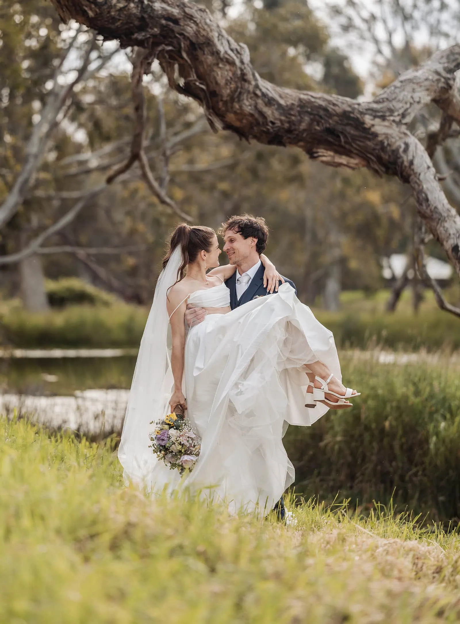fleurieu cherries wedding - kimberley & richard 70 Newlywed couple sharing a romantic kiss at sunset.