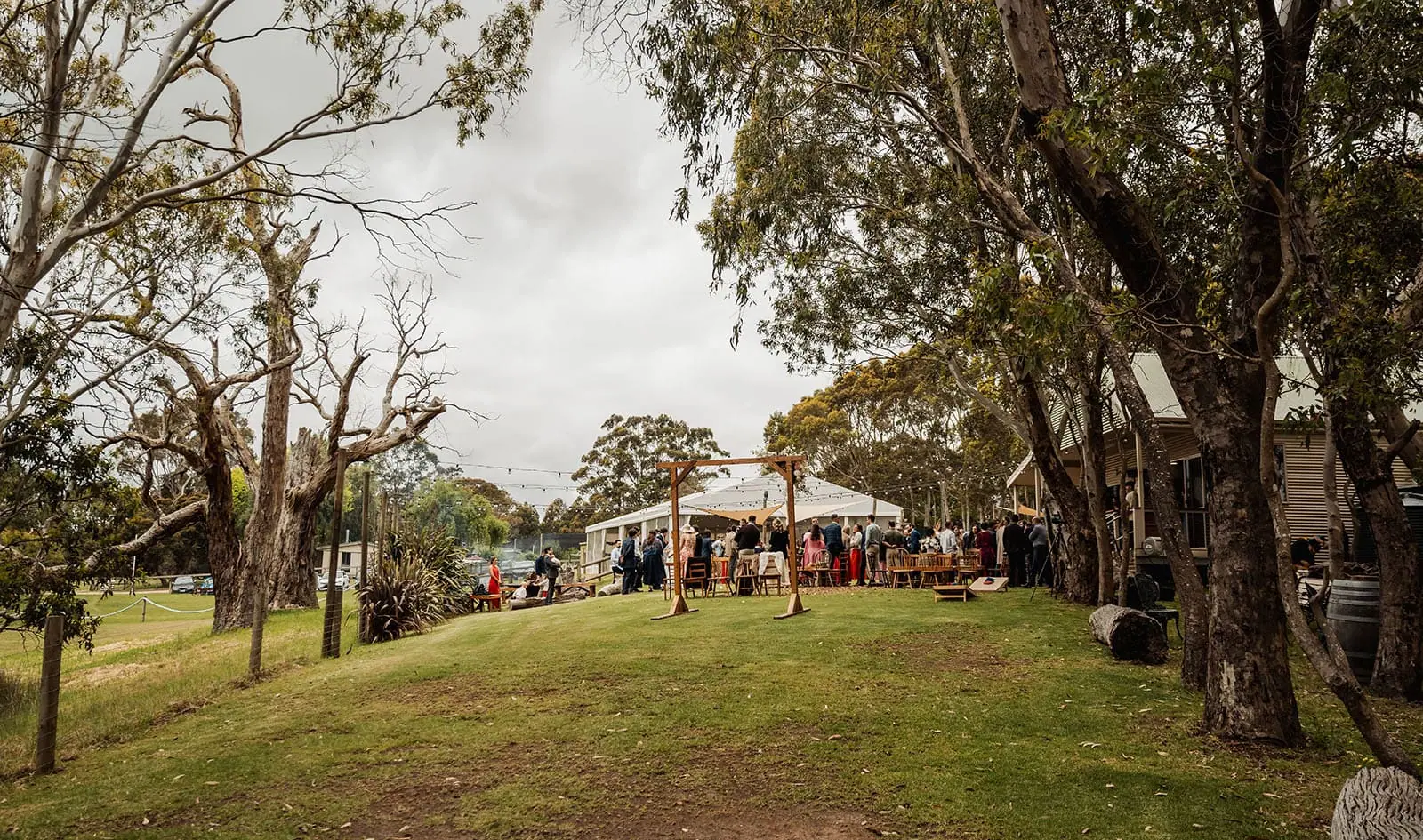 fleurieu cherries wedding - kimberley & richard 39 Outdoor event amidst vibrant greenery and scenic views.