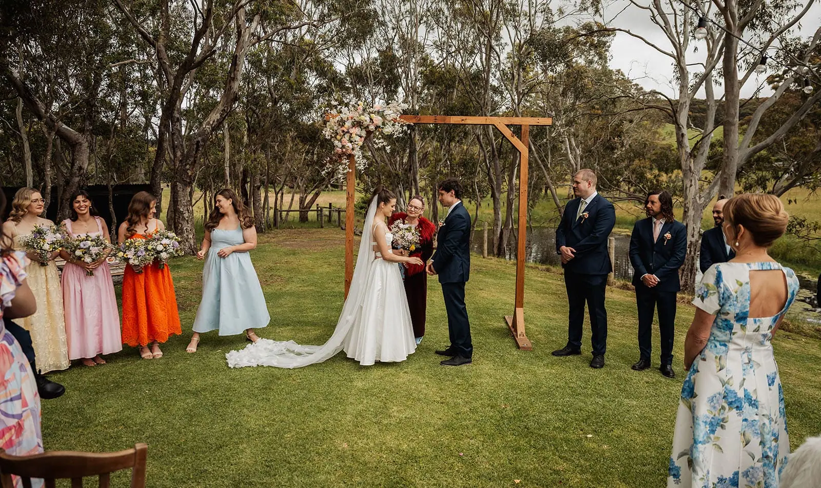 fleurieu cherries wedding - kimberley & richard 8 Outdoor Wedding Ceremony with Elegant Decor and Scenic Background.