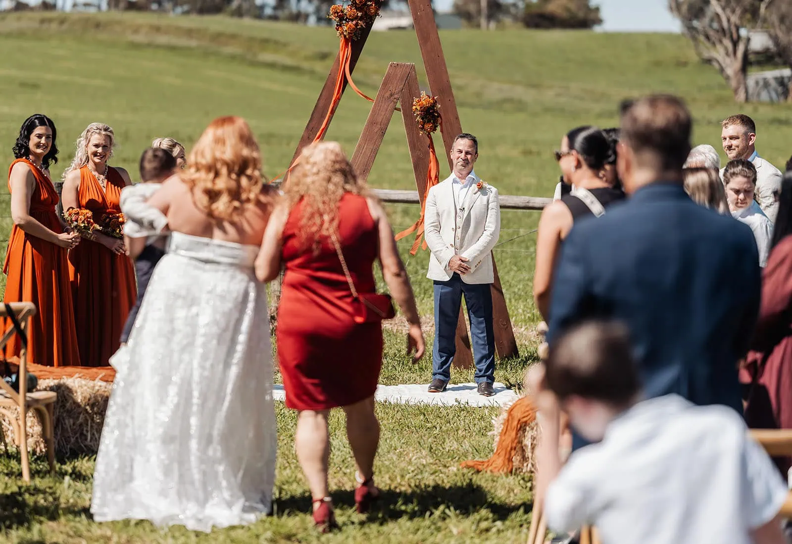 country victoria wedding in corrunnun – rachelle & anthony 317 Outdoor wedding ceremony with floral decorations and elegant seating.