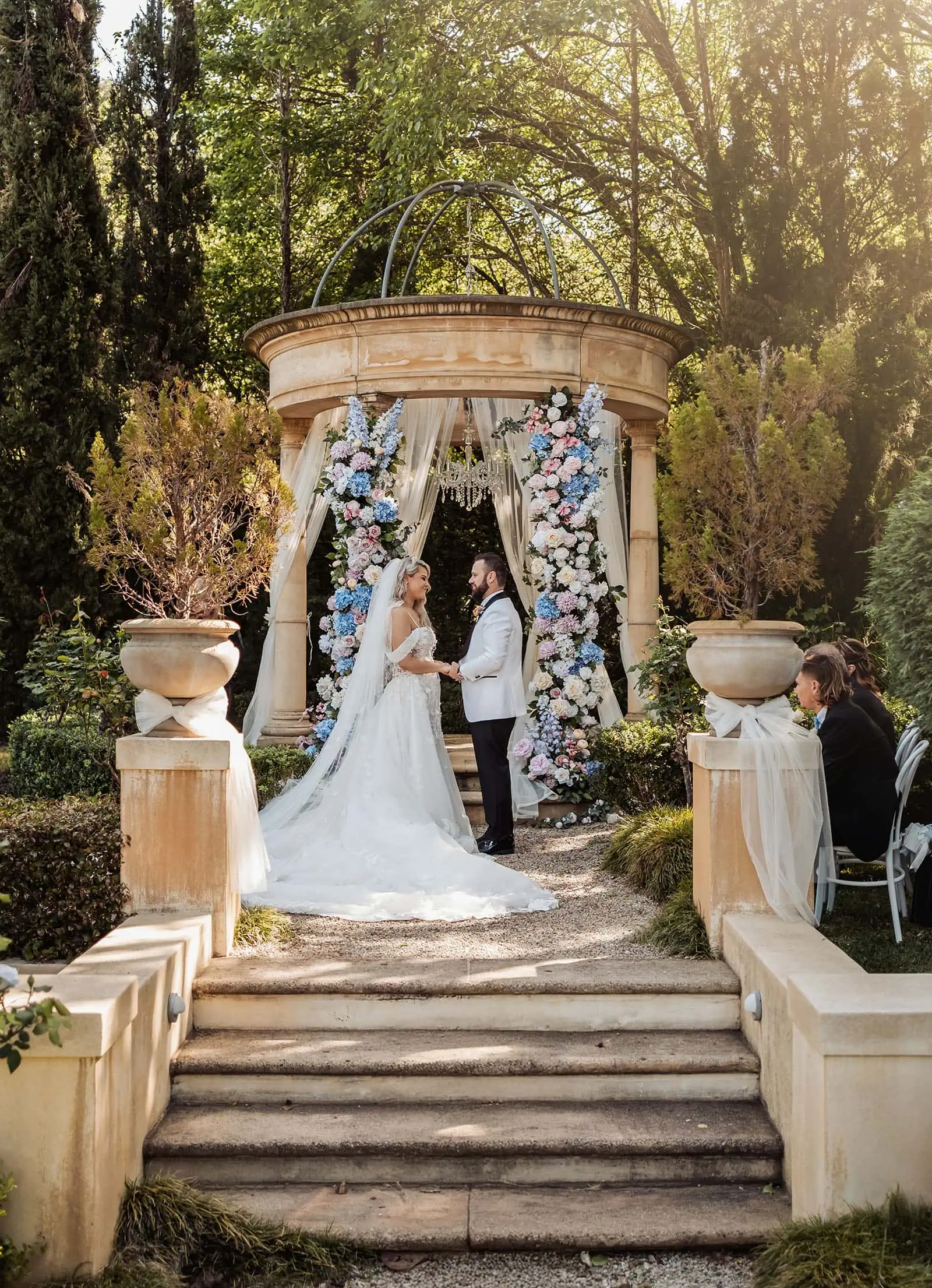 silvestris of clarendon wedding - sam & wayne 216 Elegant outdoor garden wedding with flowers and guests.