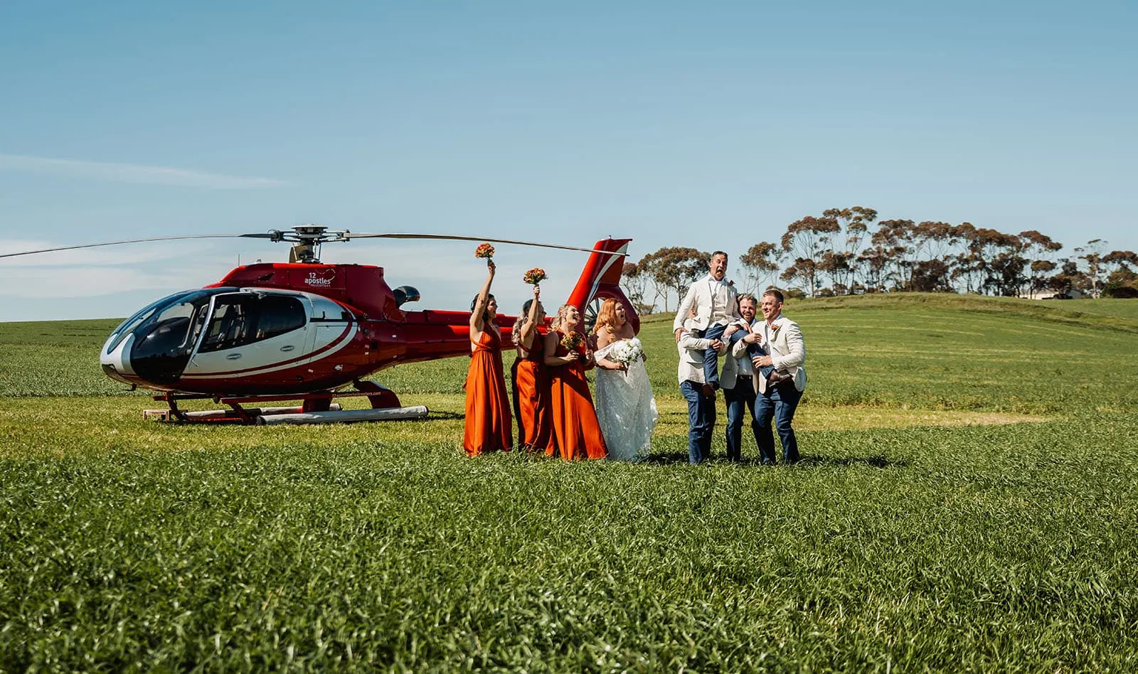 country victoria wedding in corrunnun – rachelle & anthony 325 Helicopter arrives at scenic outdoor wedding ceremony.