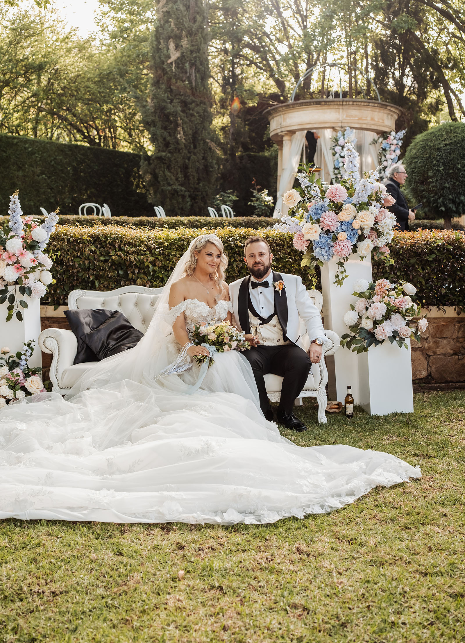 silvestris of clarendon wedding - sam & wayne 230 Elegant outdoor wedding ceremony with floral decorations and guests.