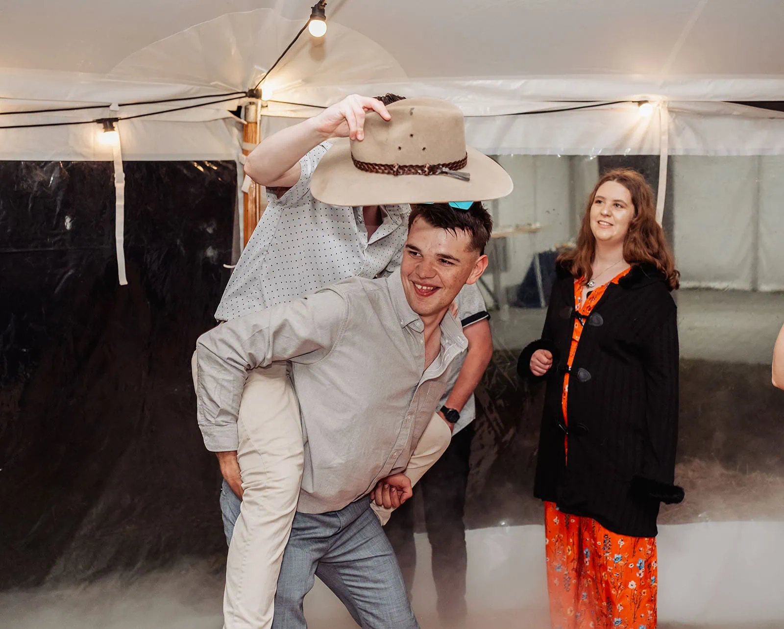 country victoria wedding in corrunnun – rachelle & anthony 377 Lively party scene with people dancing and colorful decorations.