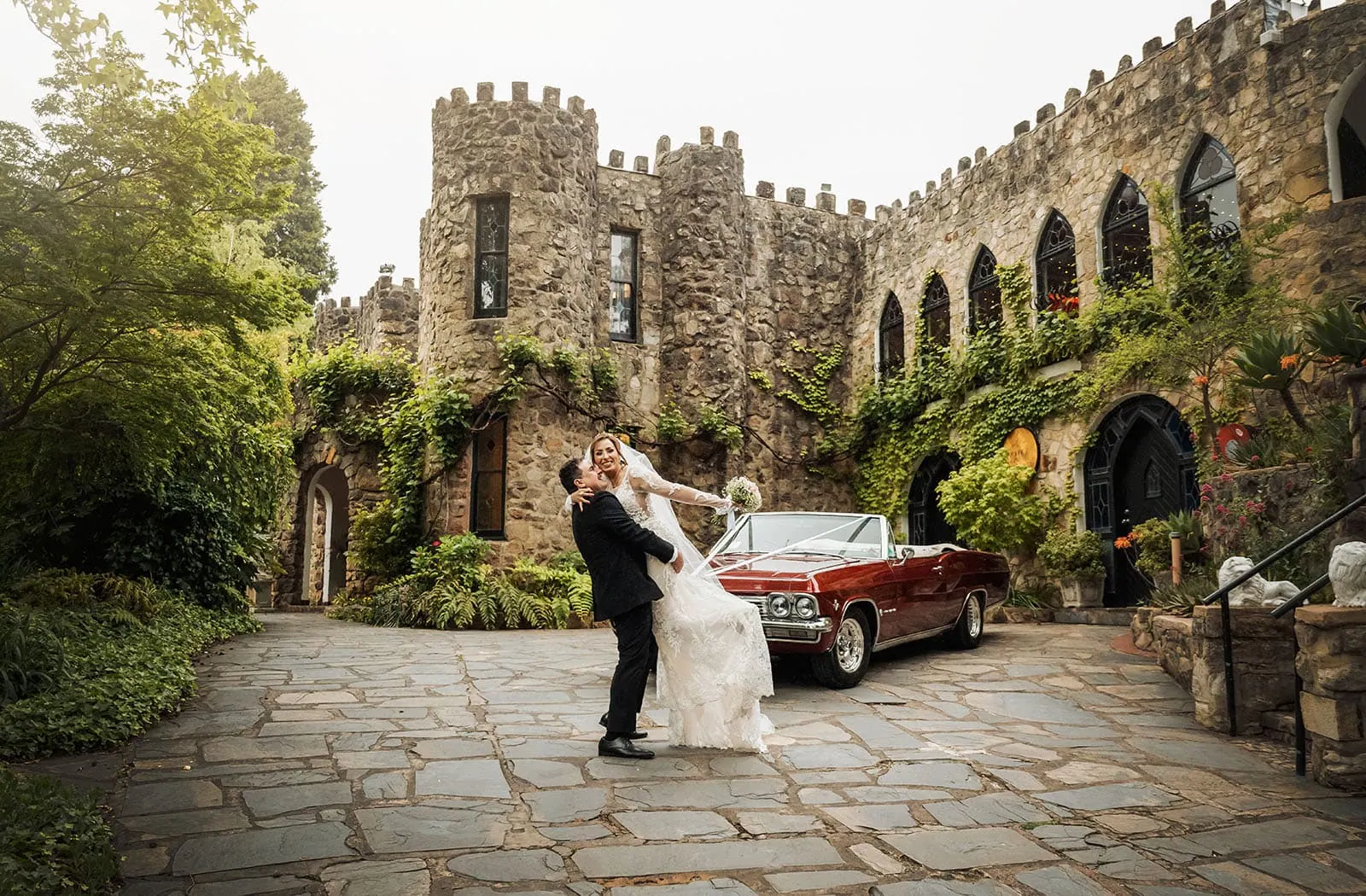wedding at the manor in basket range - maryam & jason 142 Elegant couple at castle wedding, romantic setting with picturesque castle backdrop.