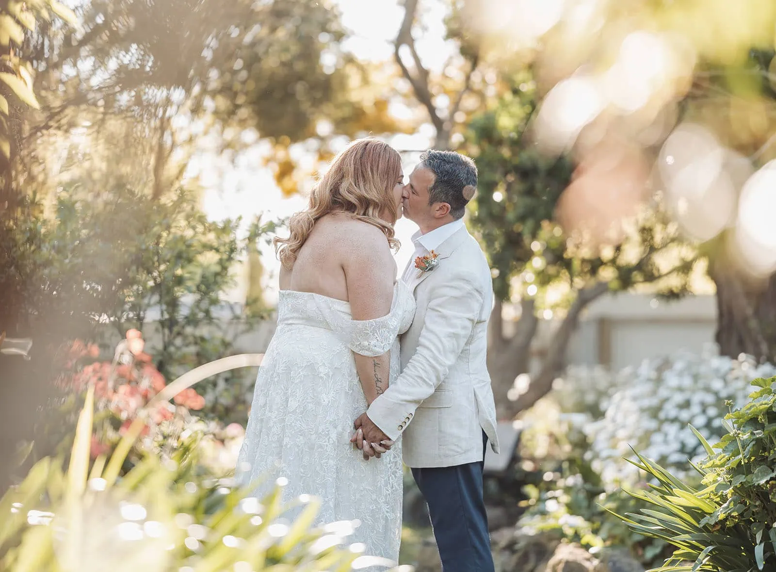 country victoria wedding in corrunnun – rachelle & anthony 358 Elegant garden wedding with flowers, romantic lighting, and a beautifully decorated archway.