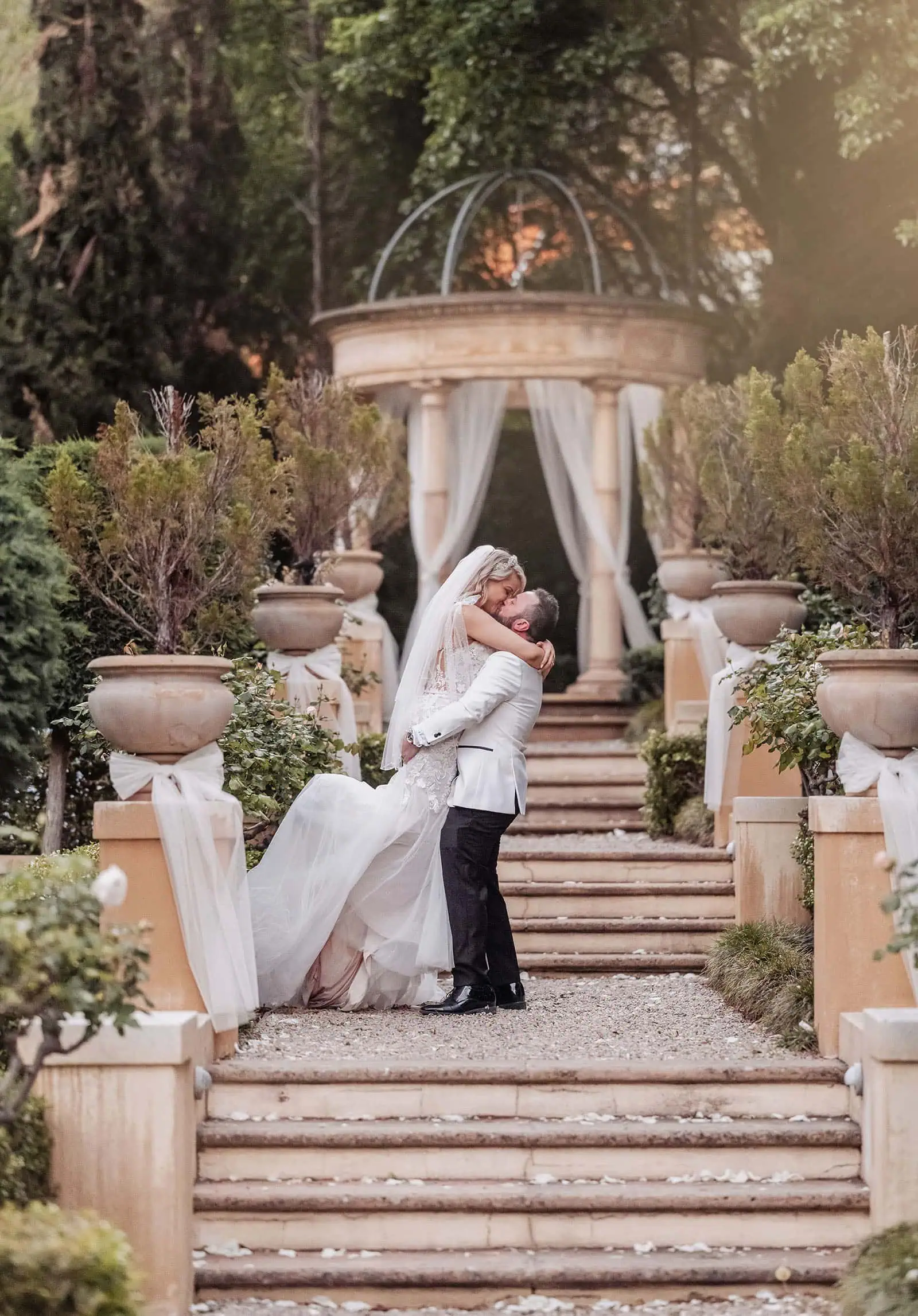 silvestris of clarendon wedding - sam & wayne 242 Romantic outdoor wedding gazebo decorated with flowers and lights.