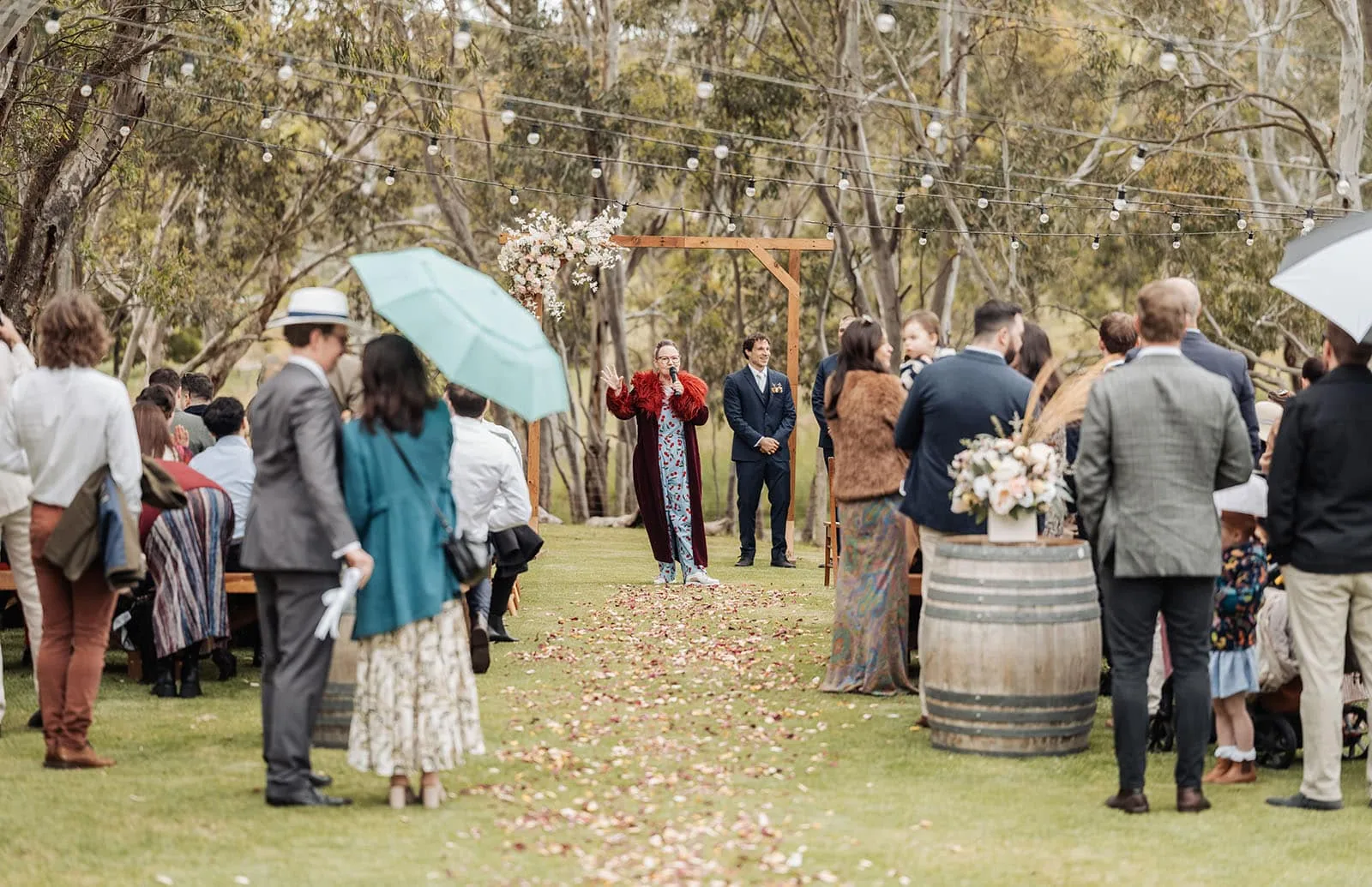 fleurieu cherries wedding - kimberley & richard 3 Rustic outdoor wedding ceremony with natural decor and scenic backdrop.