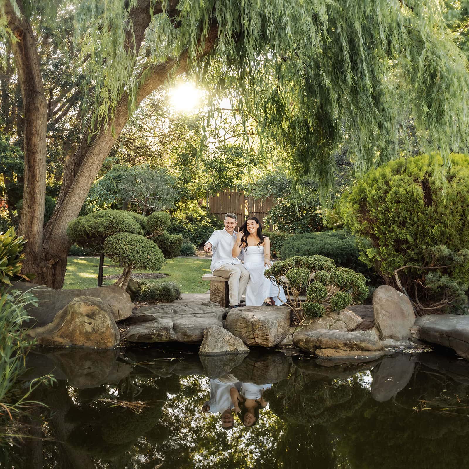 himeji gardens couples shoot - tom & tess 92 Couple enjoying a peaceful garden retreat surrounded by lush greenery.