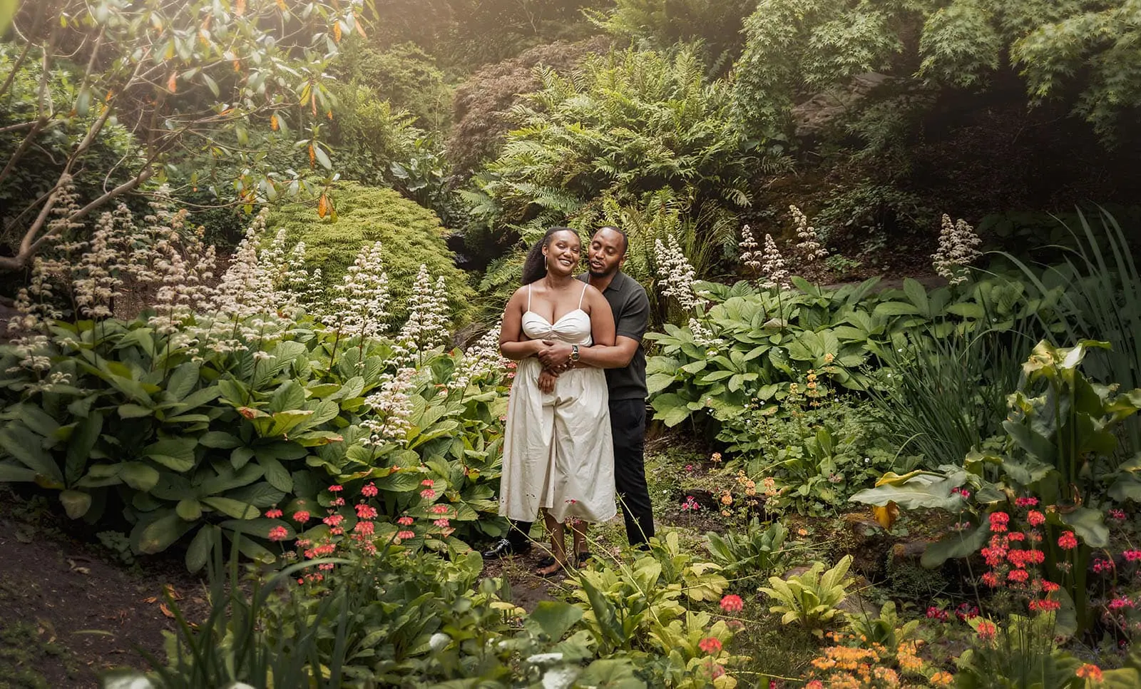 mt lofty botanic gardens couples shoot – ruth & emanuel 22 Couple relaxing in lush, tranquil garden landscape.