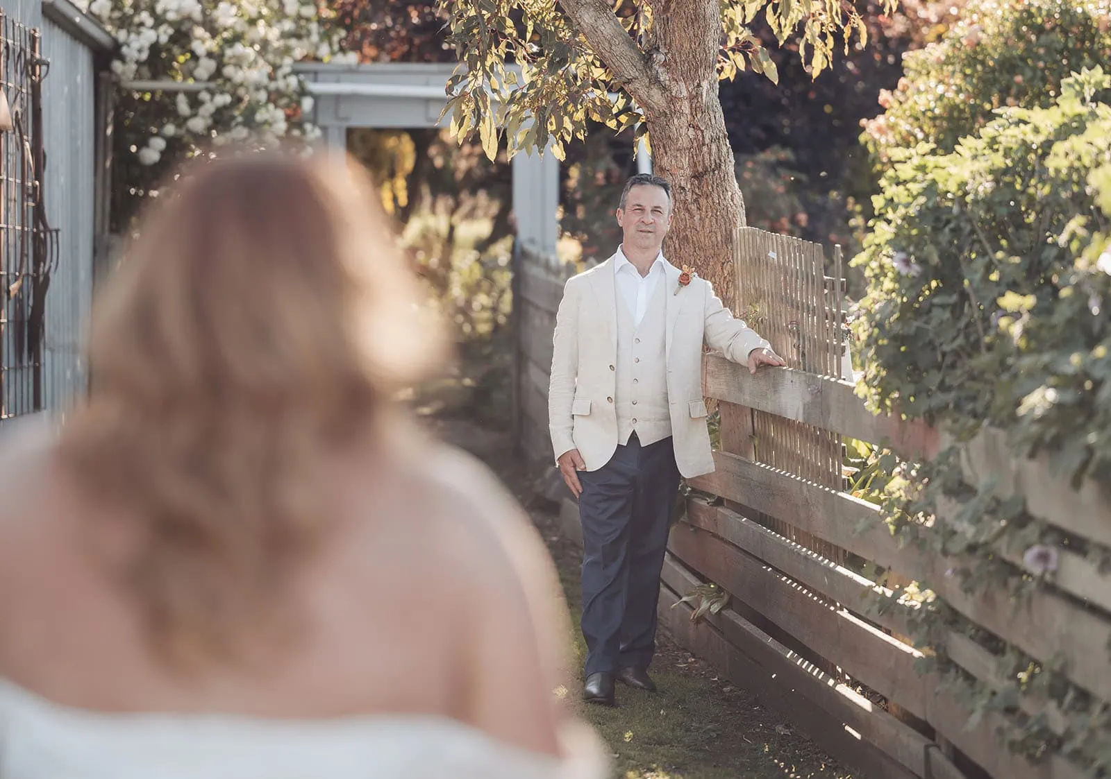 country victoria wedding in corrunnun – rachelle & anthony 353 Peaceful garden scene with blooming flowers and a tranquil pond.